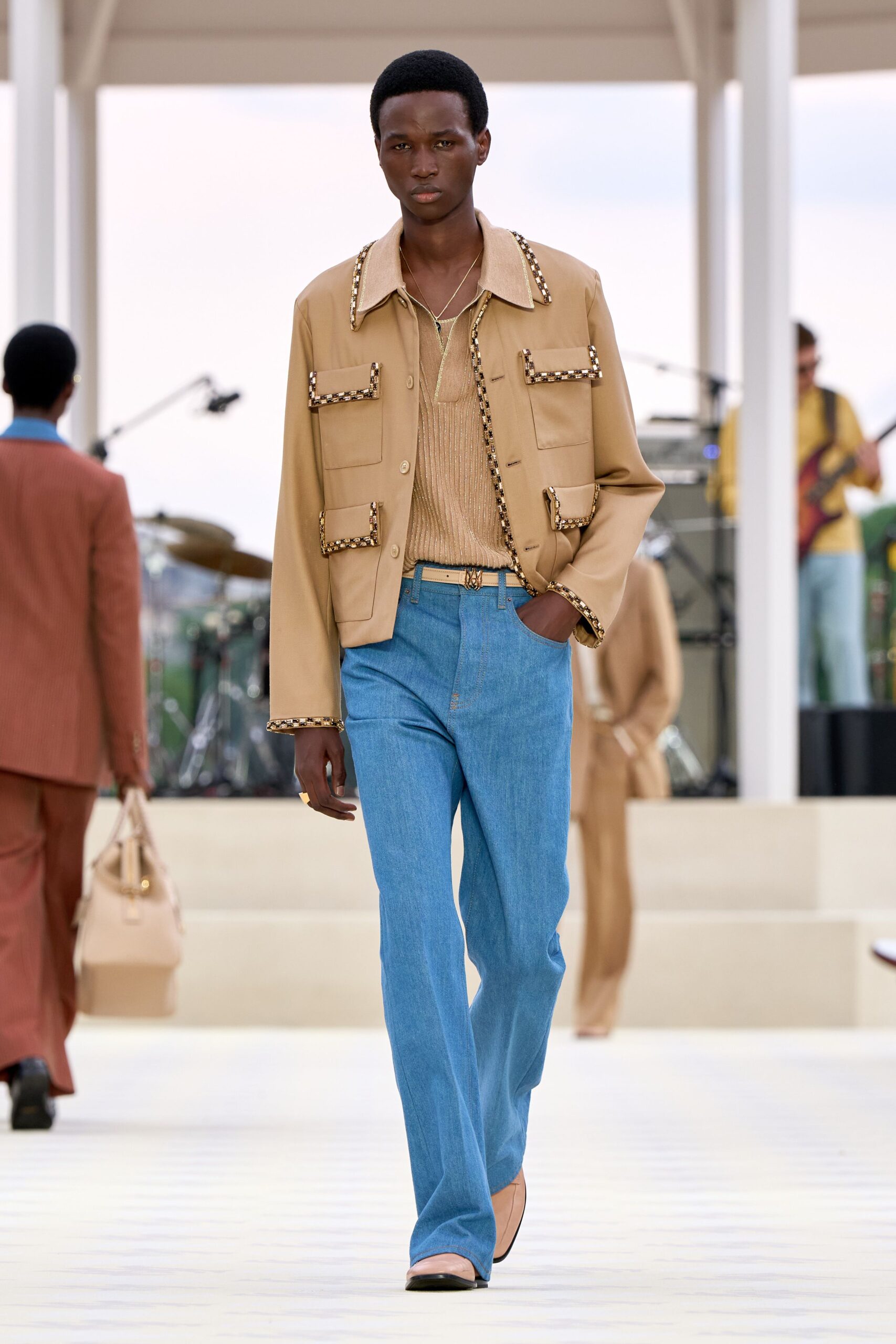 beige jacket with blue pants
