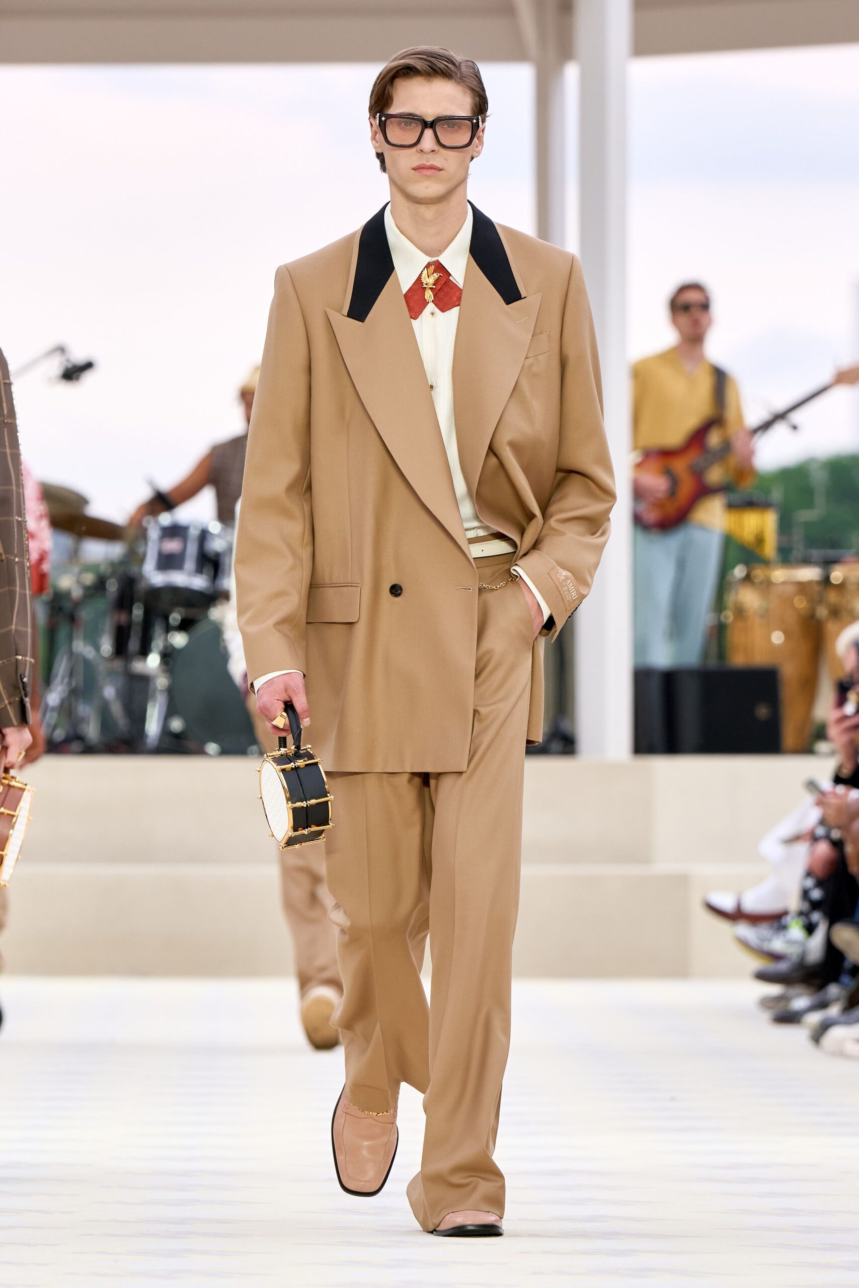 beige tailored suit with white shirt