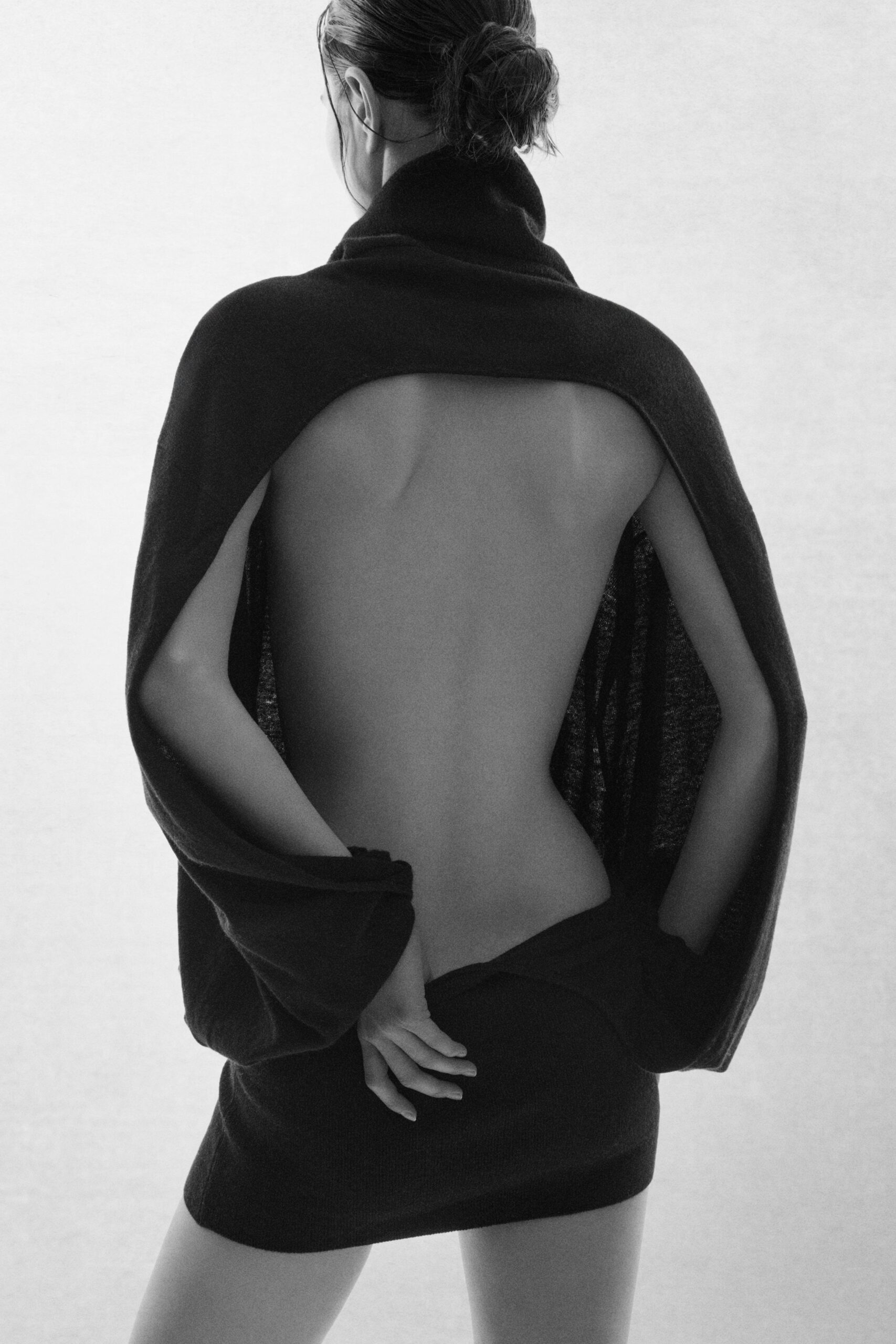 black wool sleeveless backless fitted draped mini dress