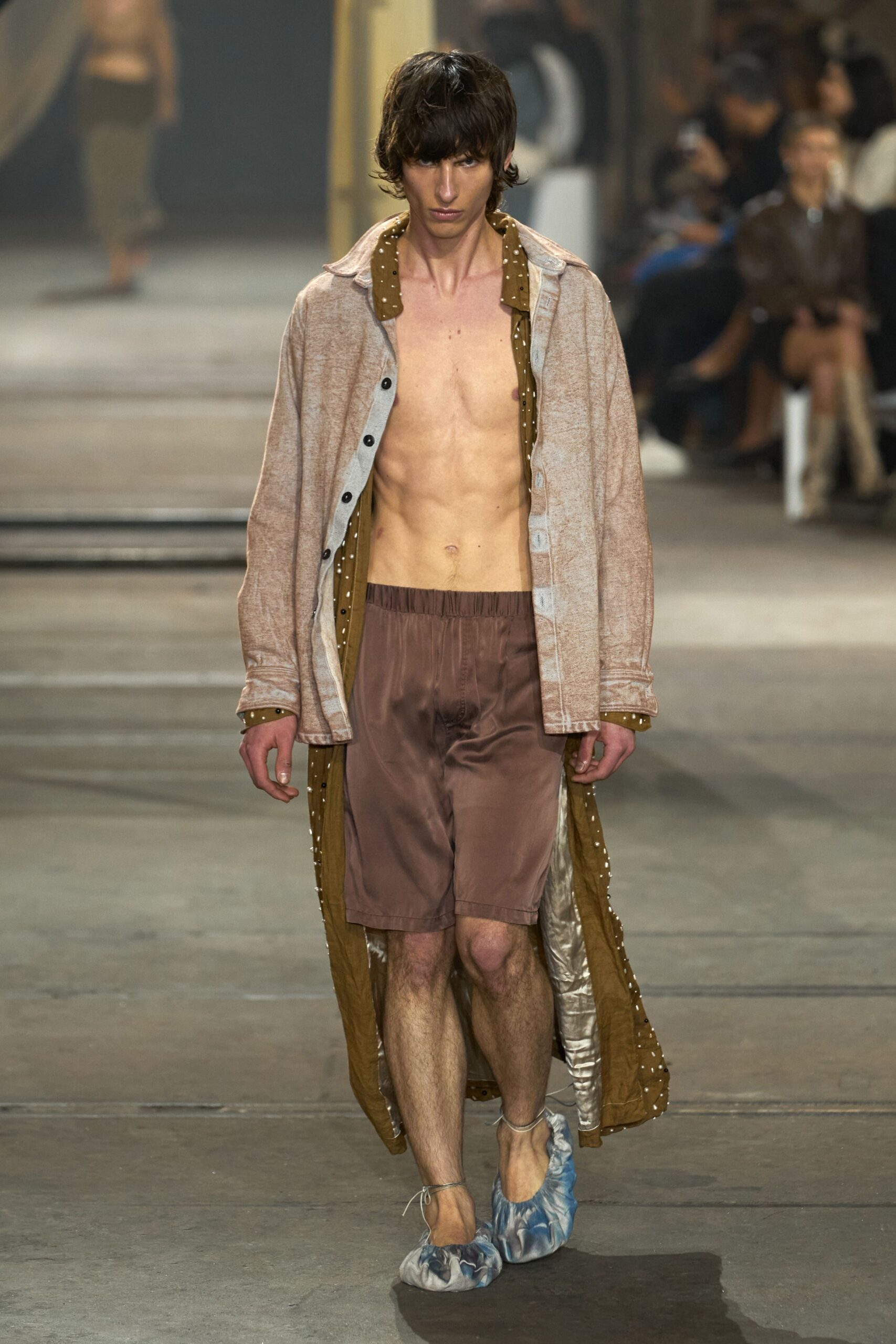 beige coat brown shorts blue shoes