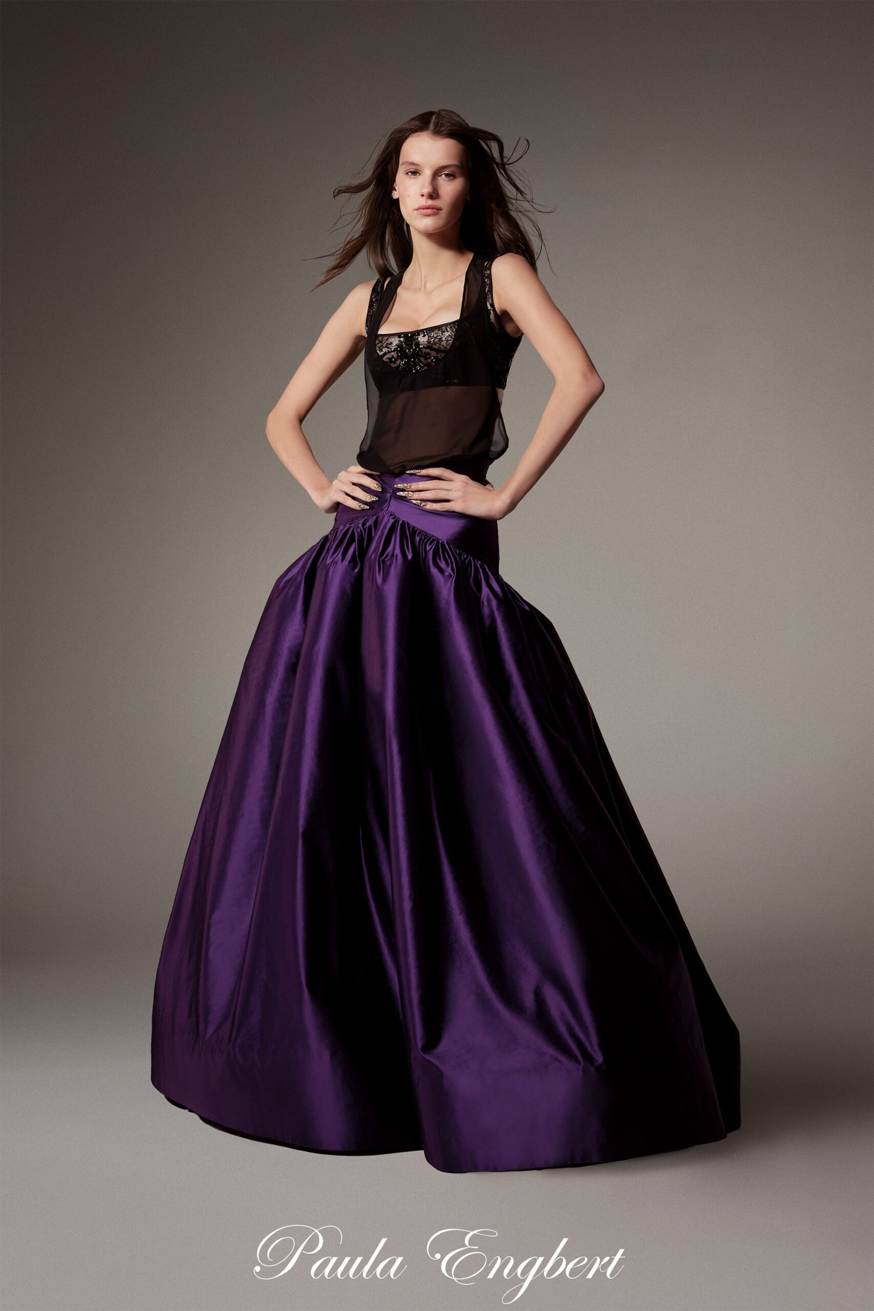 black silk sleeveless top and purple satin skirt