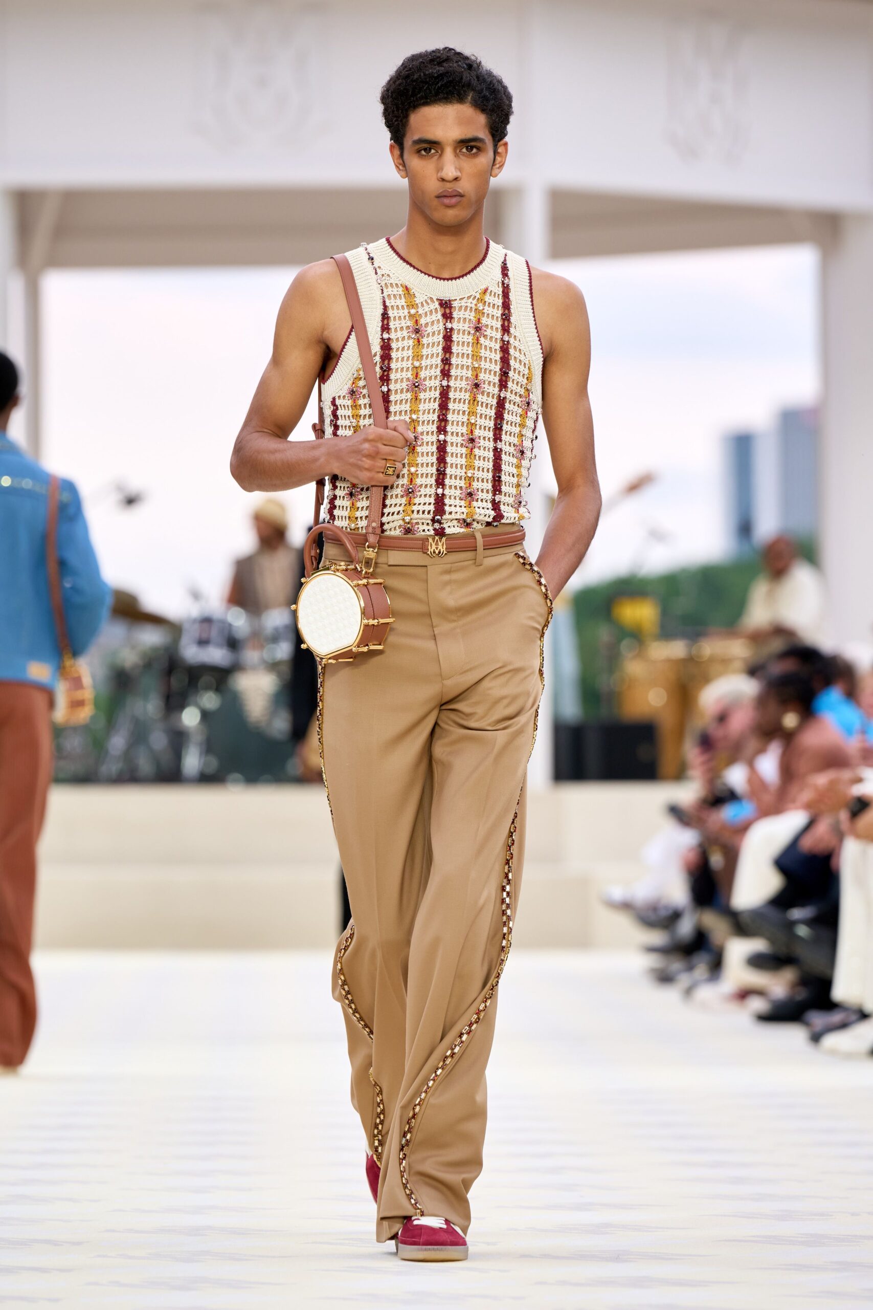 white striped tank-top beige pants