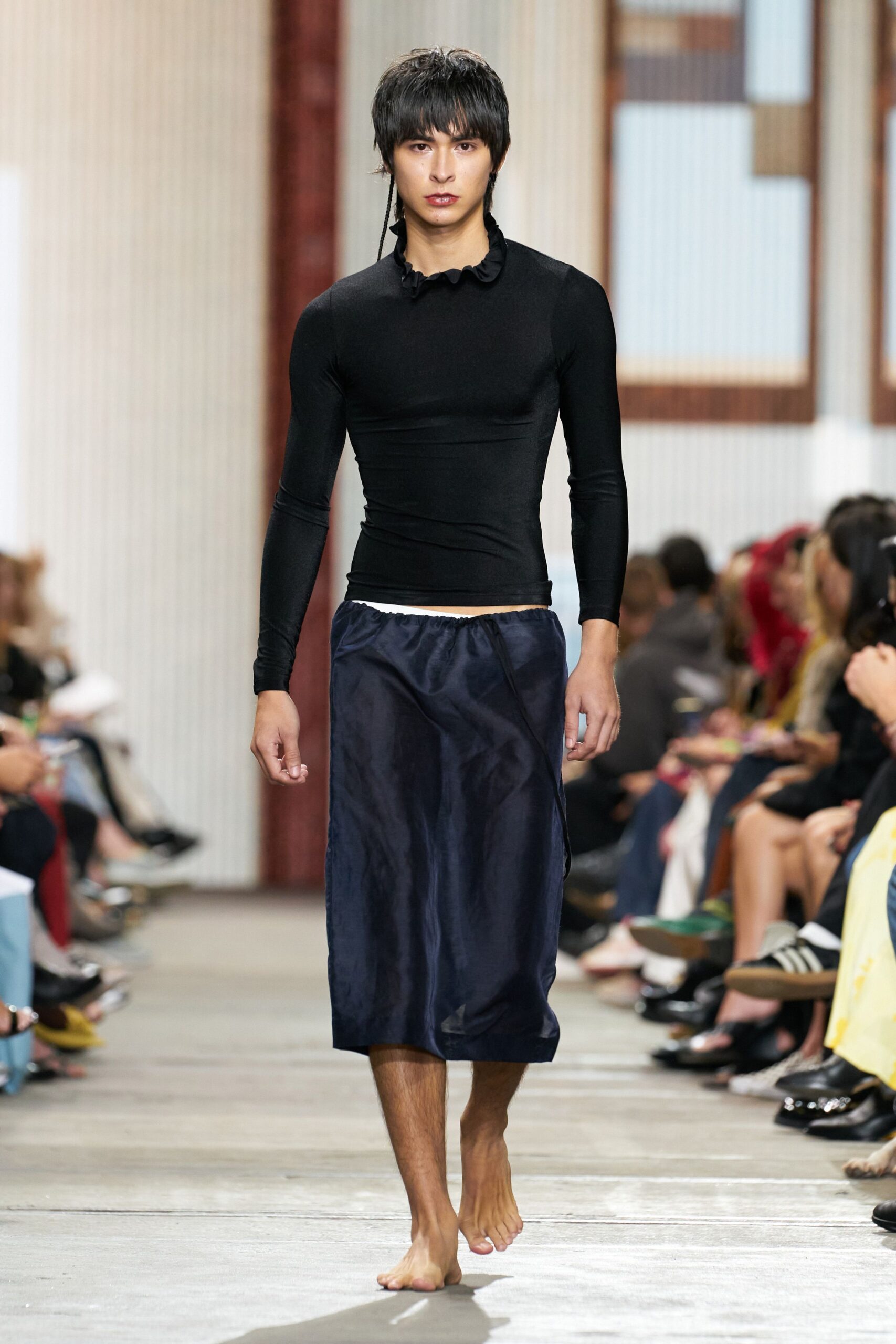 black fitted top with blue pants