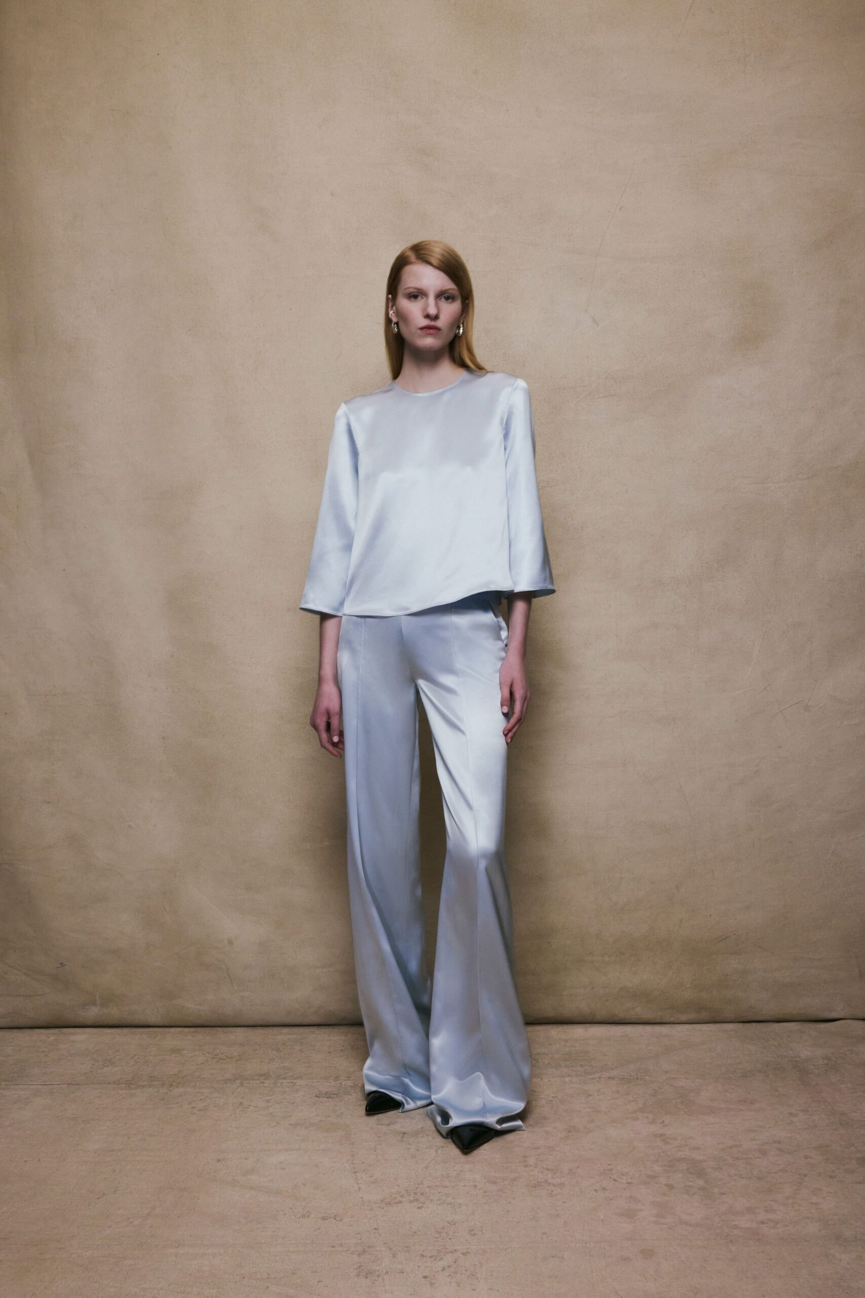 blue silk relaxed top and flared pants