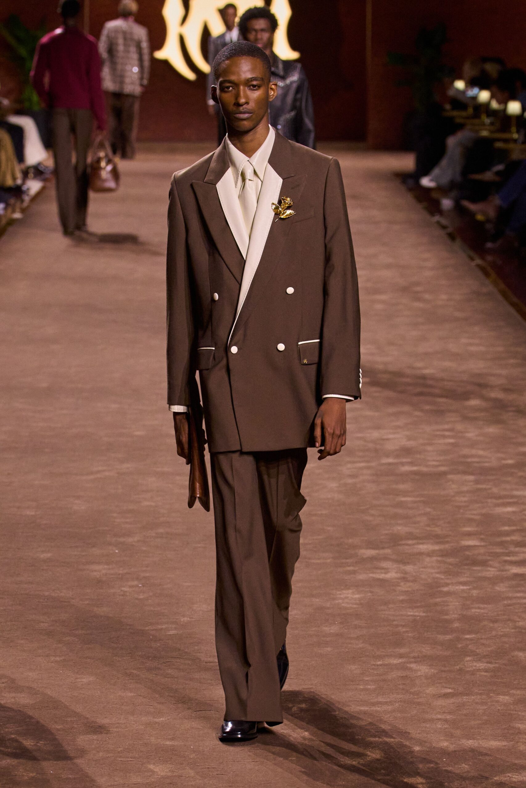 brown tailored suit with white shirt