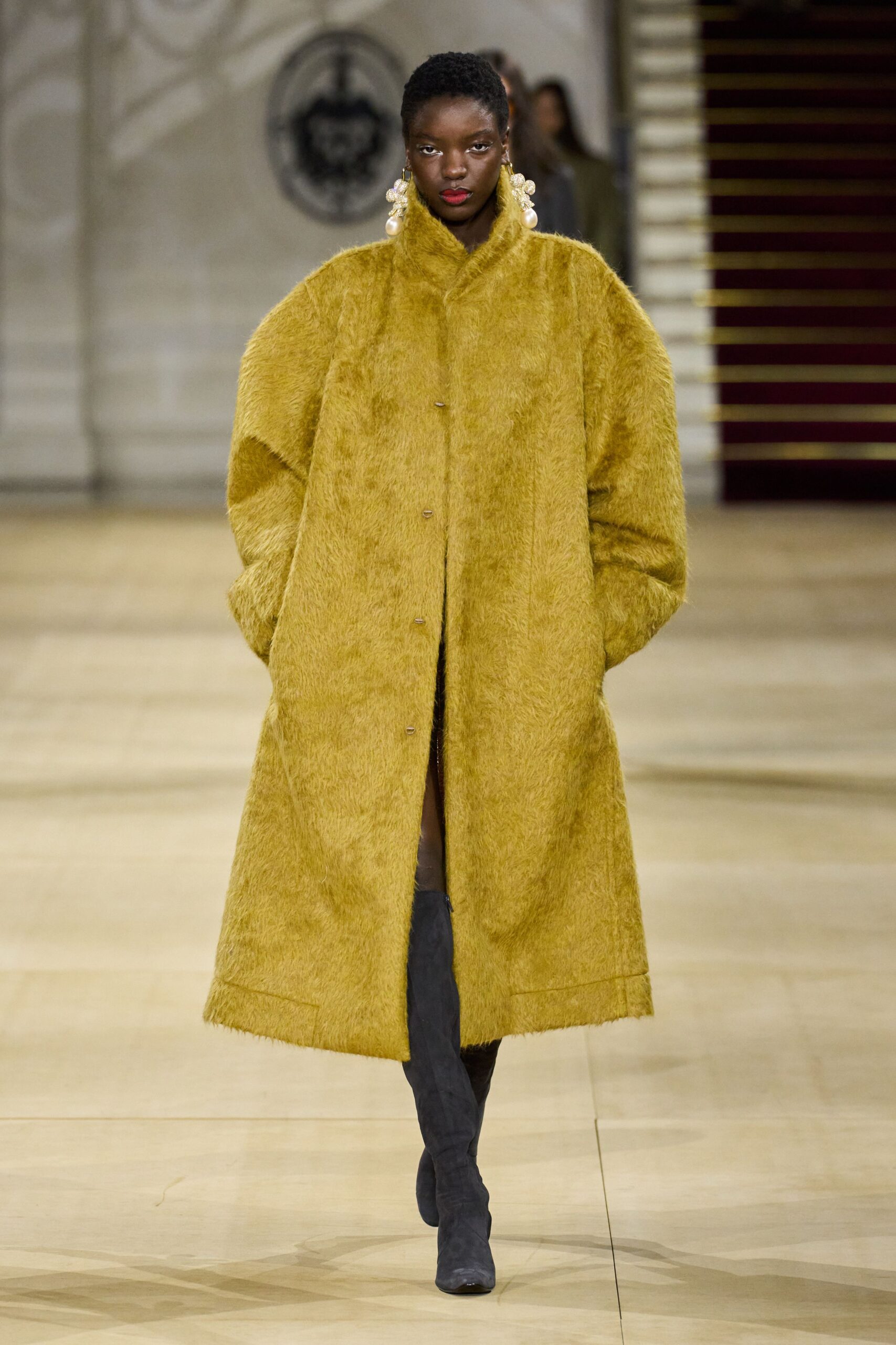 oversized yellow faux-fur coat with gray boots