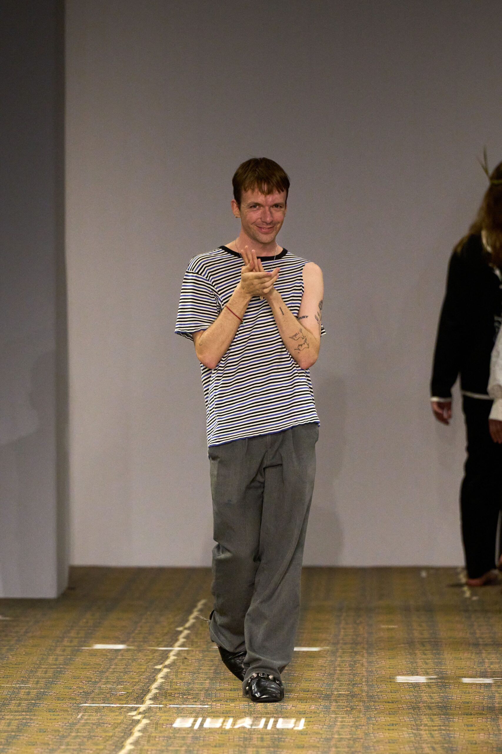 striped t-shirt with gray pants