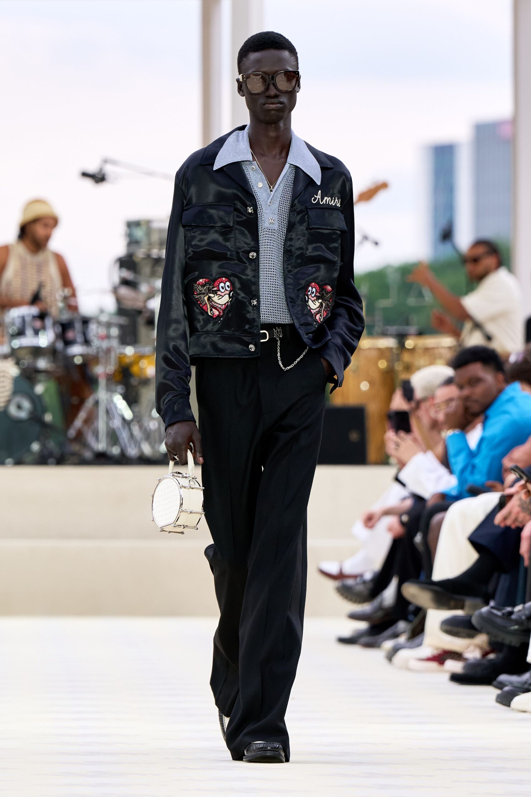 black jacket white shirt relaxed pants