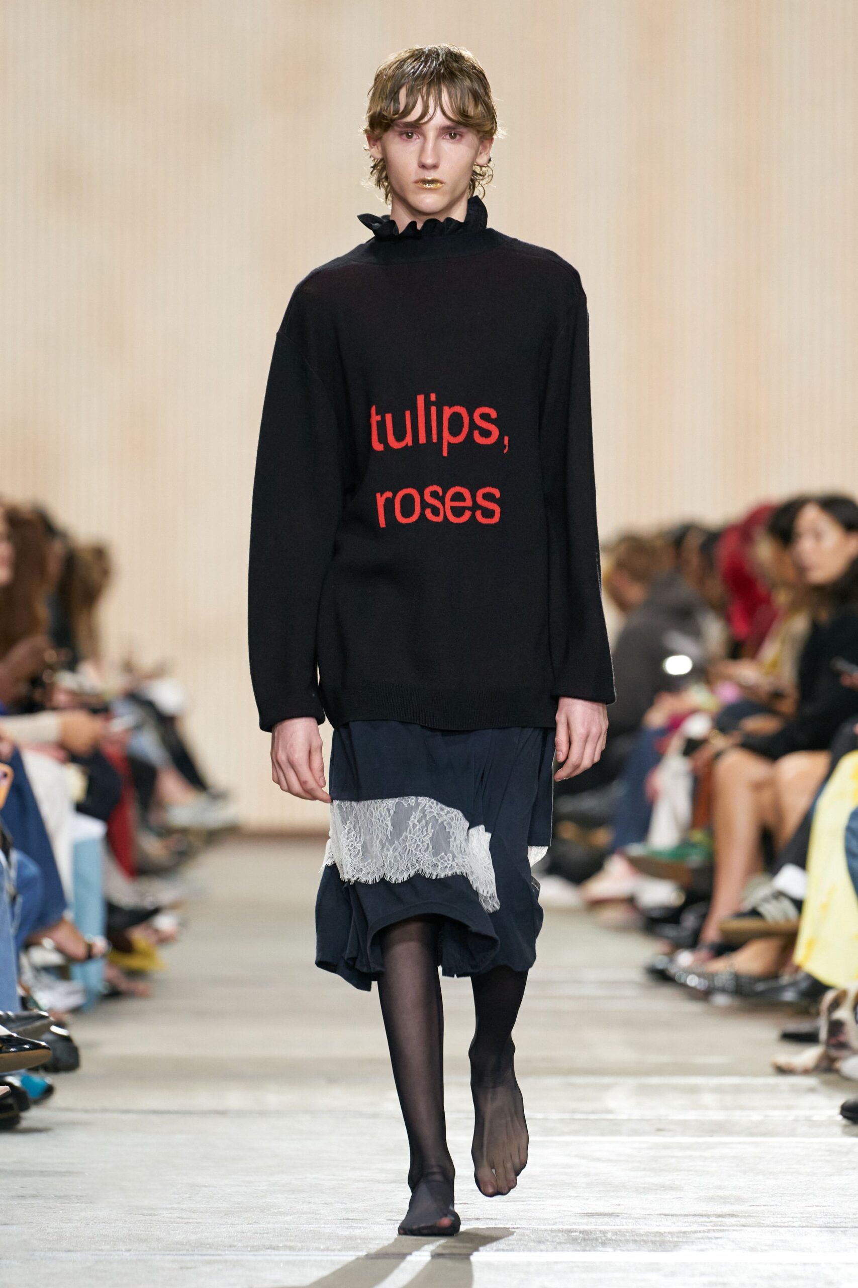 black relaxed sweater with printed text