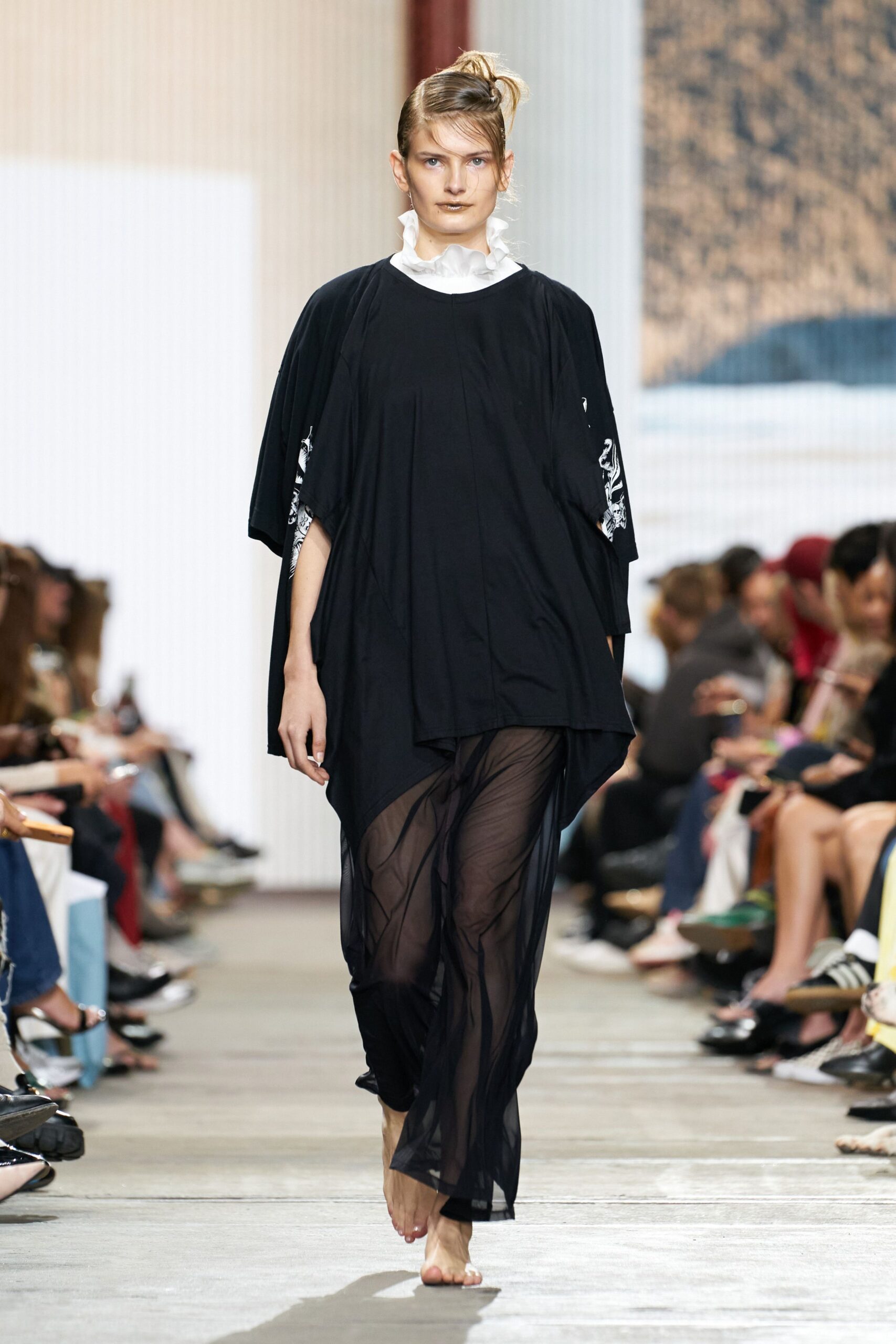 black relaxed top with sheer pants