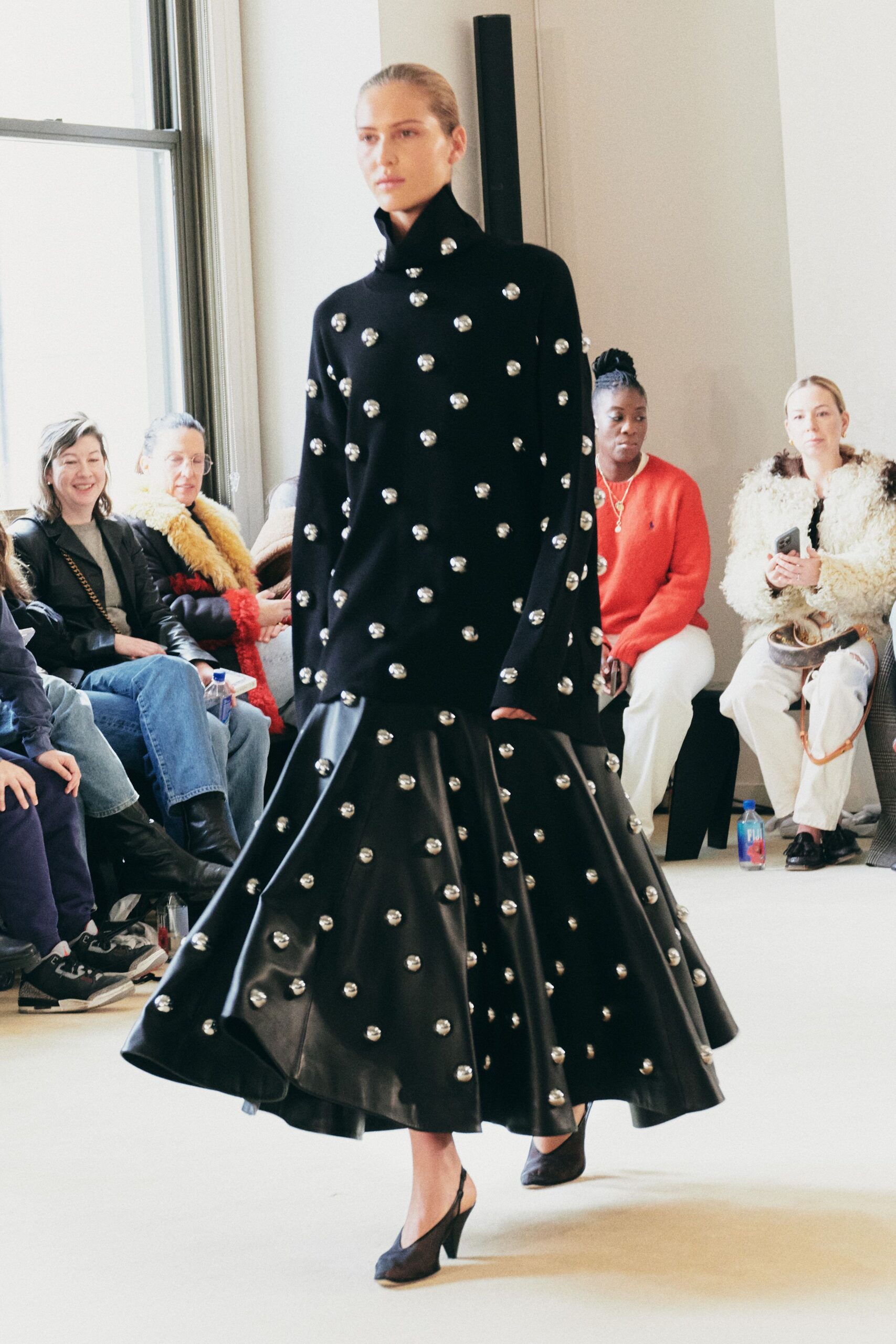 black wool sweater and leather skirt