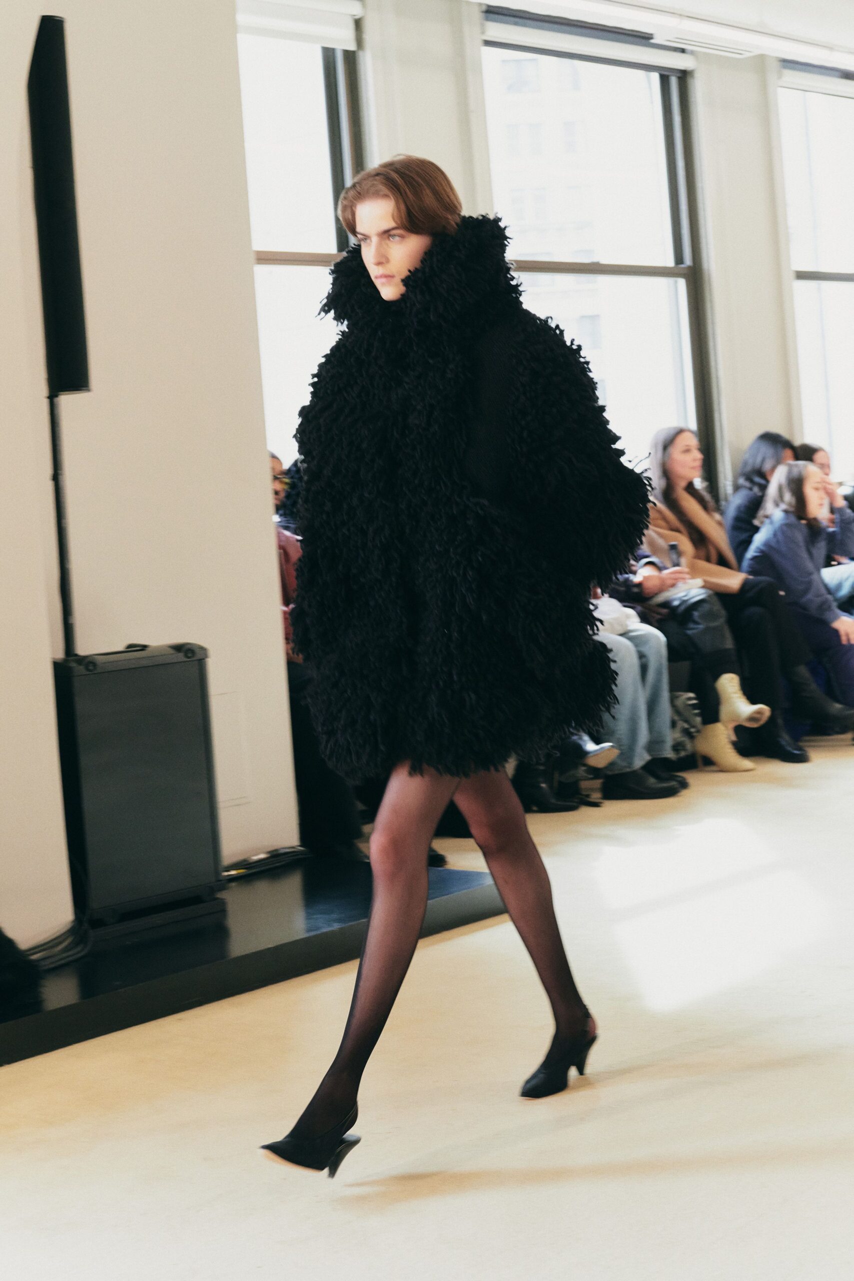 black oversized fur coat and shoes