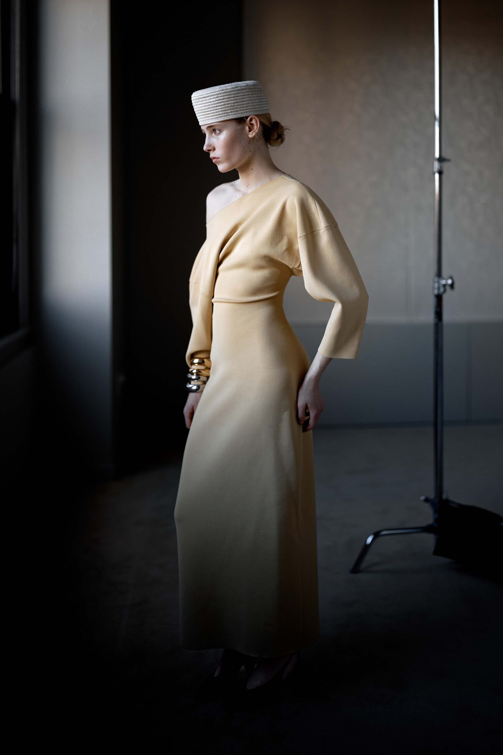 beige silk fitted gown with hat