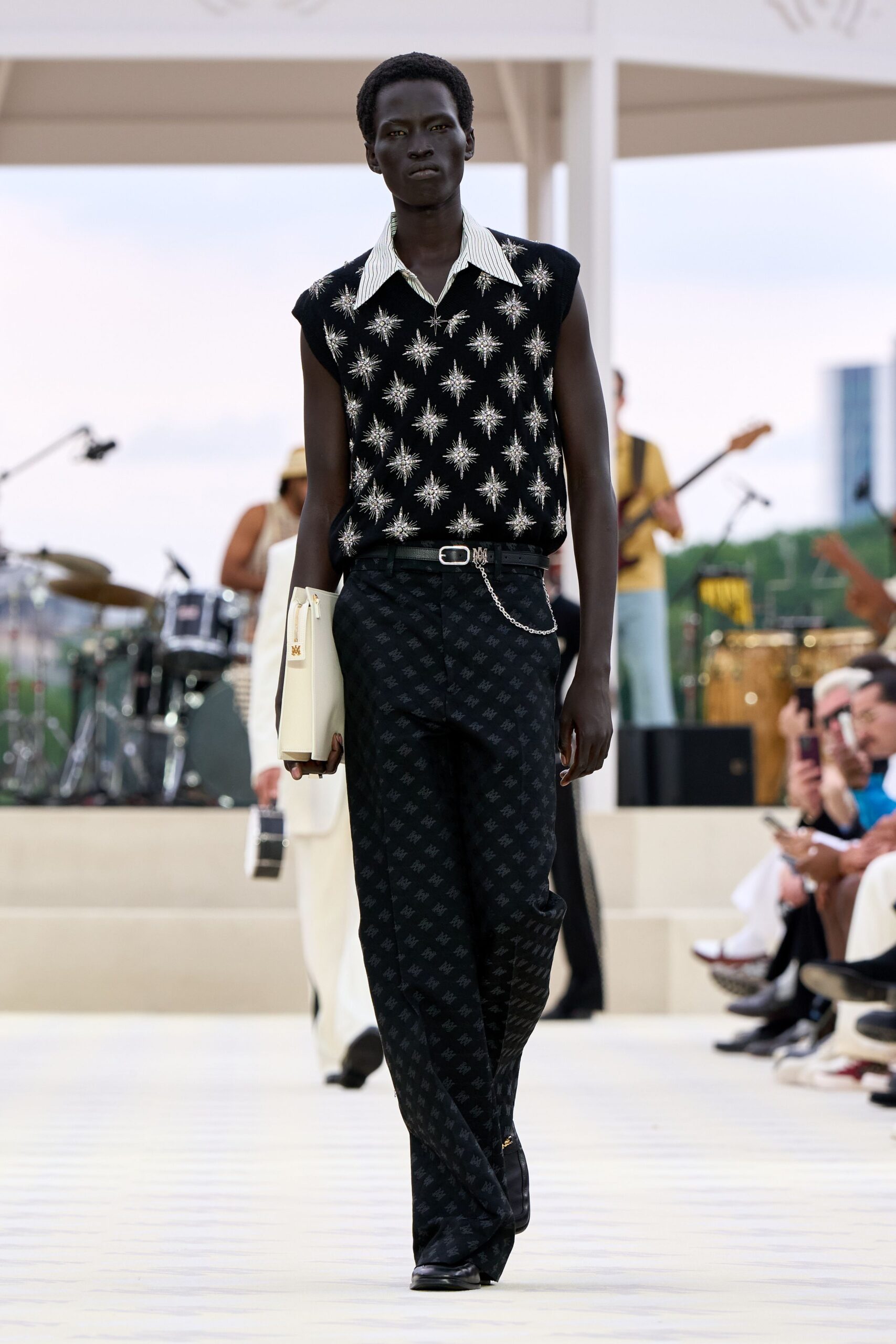 black and white embroidered top with slim pants