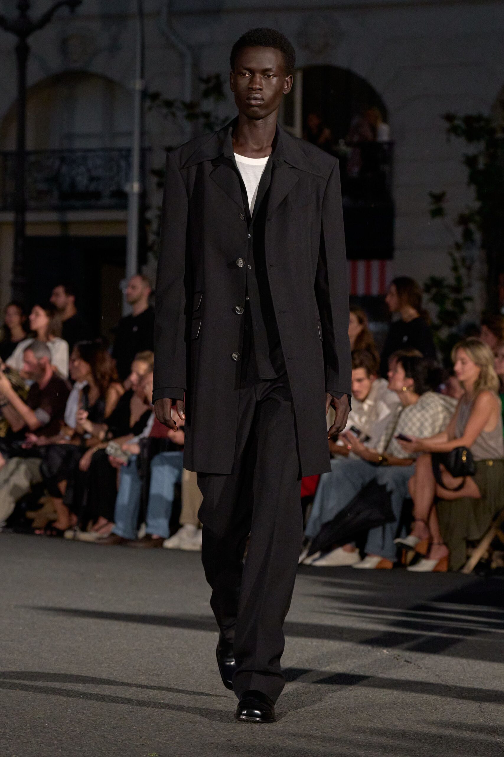 black wool long-sleeve collared structured buttoned pockets coat