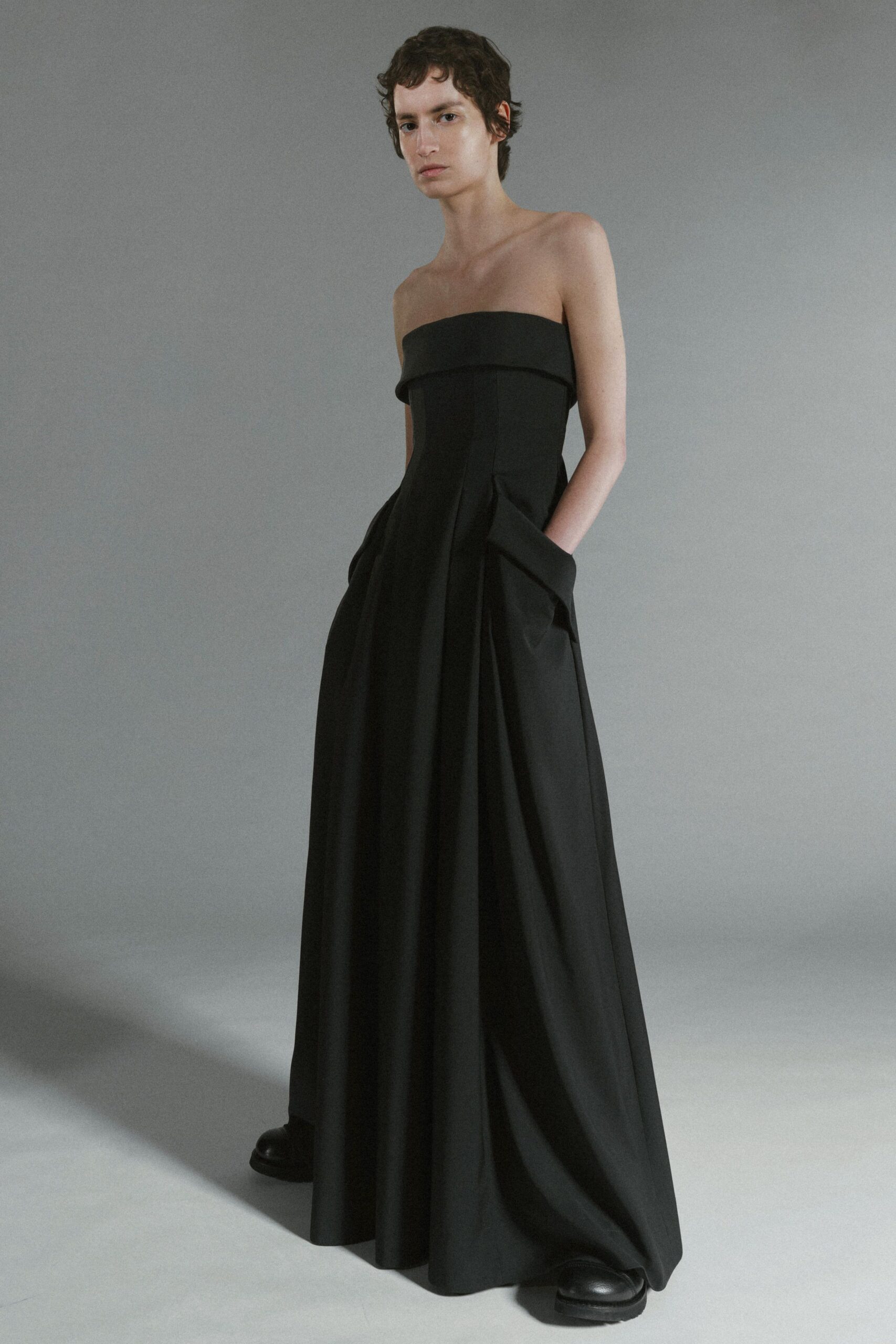 black strapless pleated gown