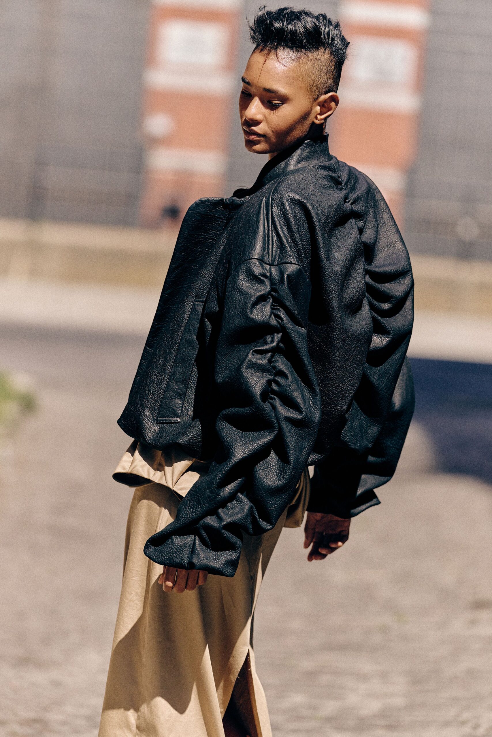 black leather long-sleeve oversized padded jacket