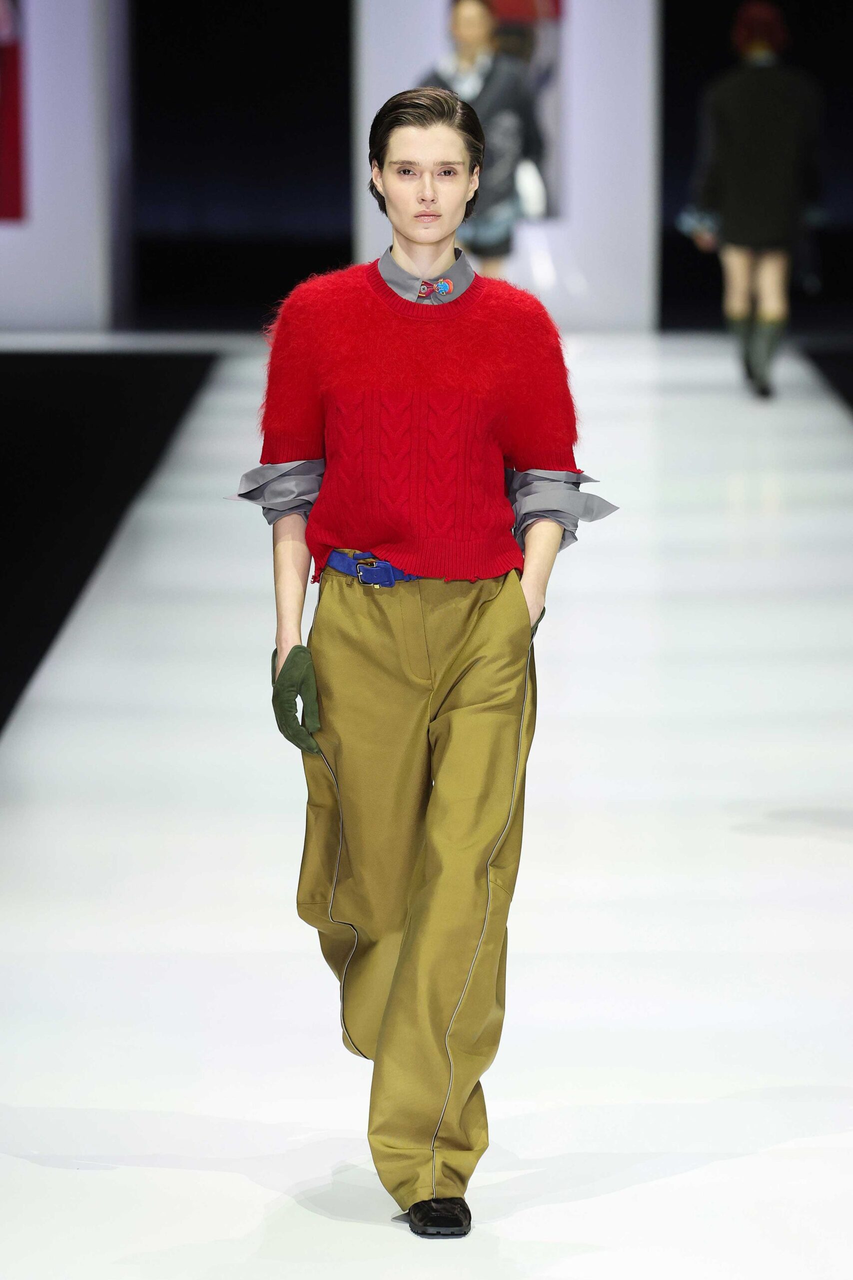 red wool sweater with beige pants