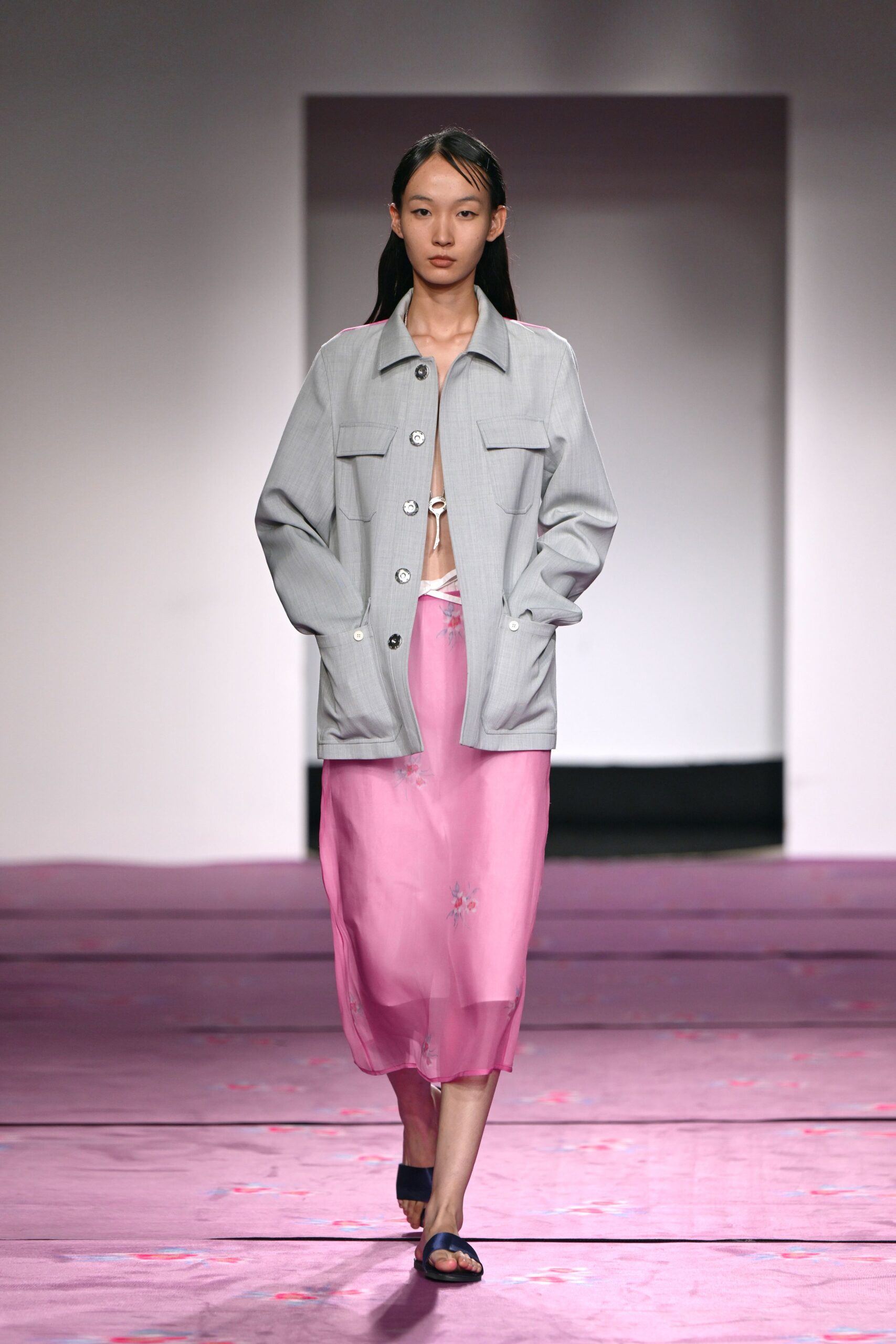 gray jacket pink skirt blue shoes