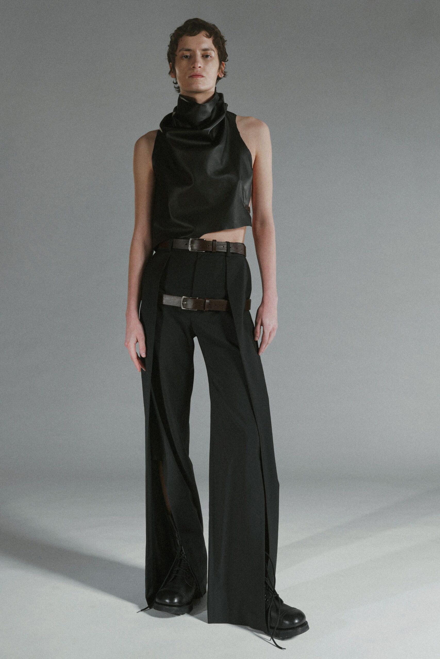 black leather sleeveless high-neck fitted draped top