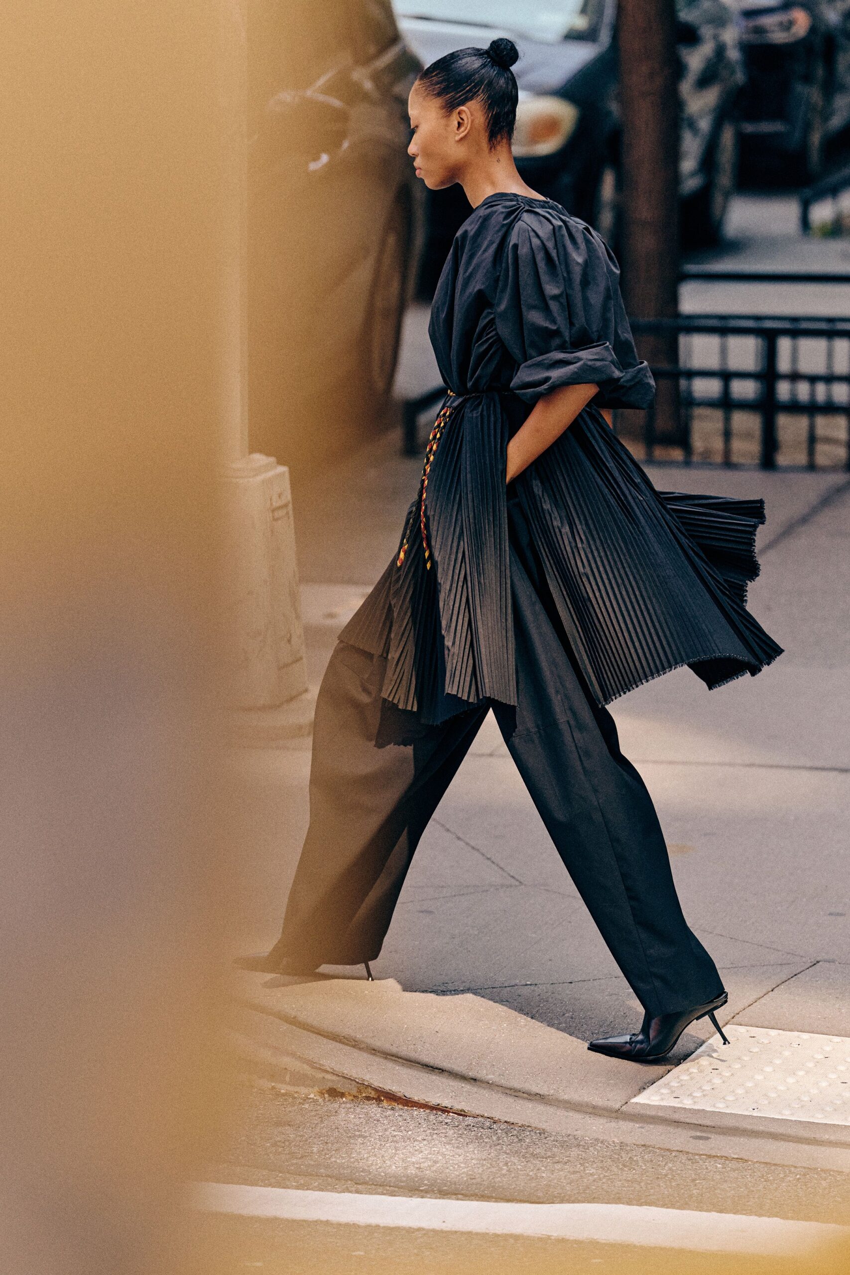 black cotton long-sleeve v-neck fitted pleated belted jumpsuit