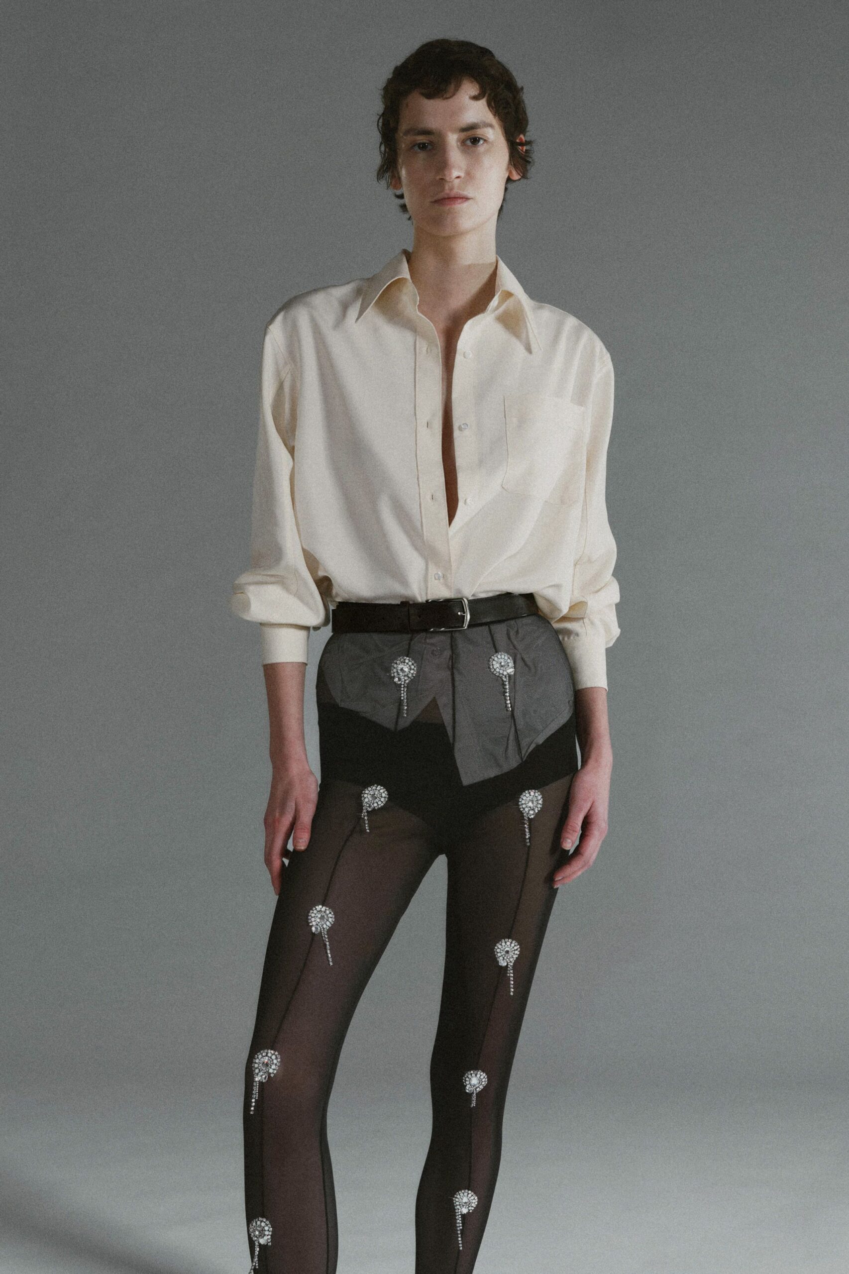 white relaxed shirt with black shorts
