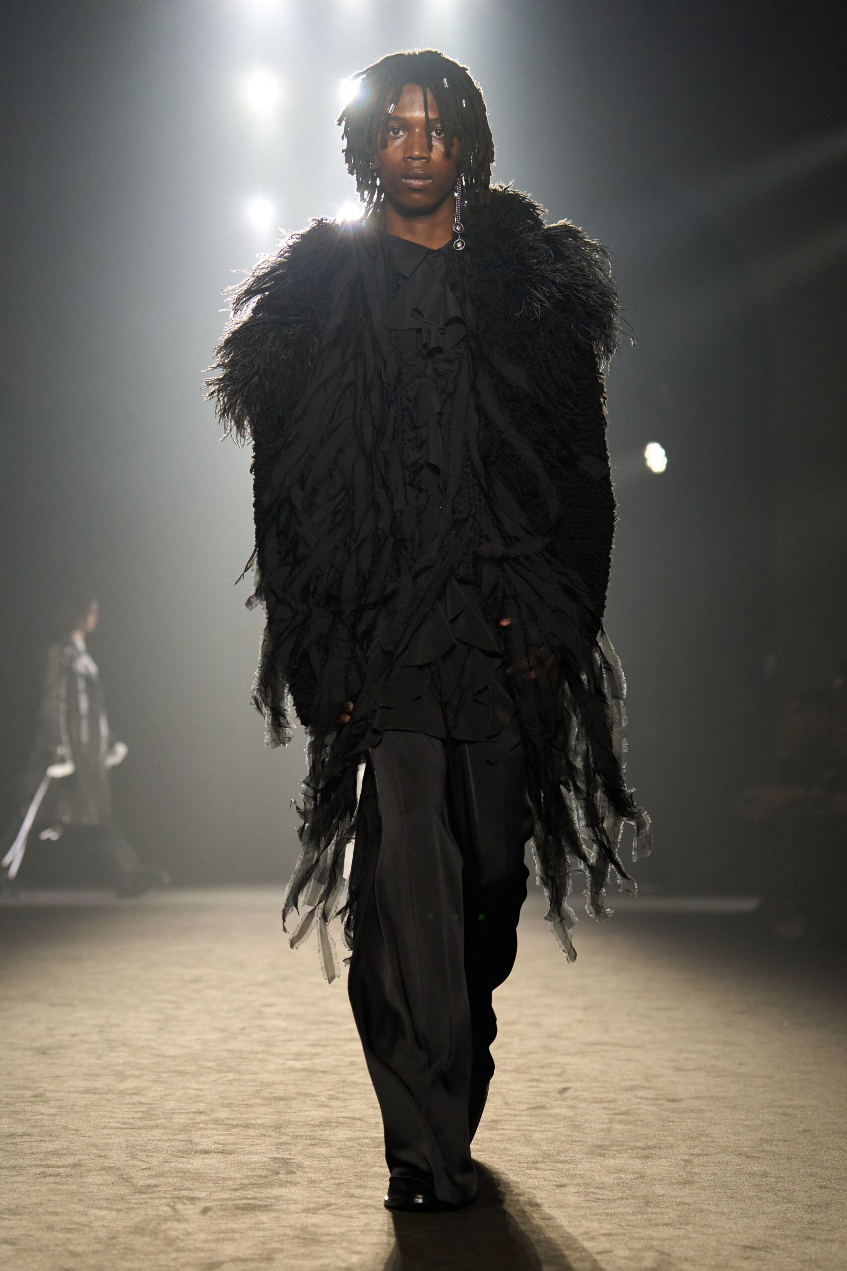 black relaxed coat with layered details