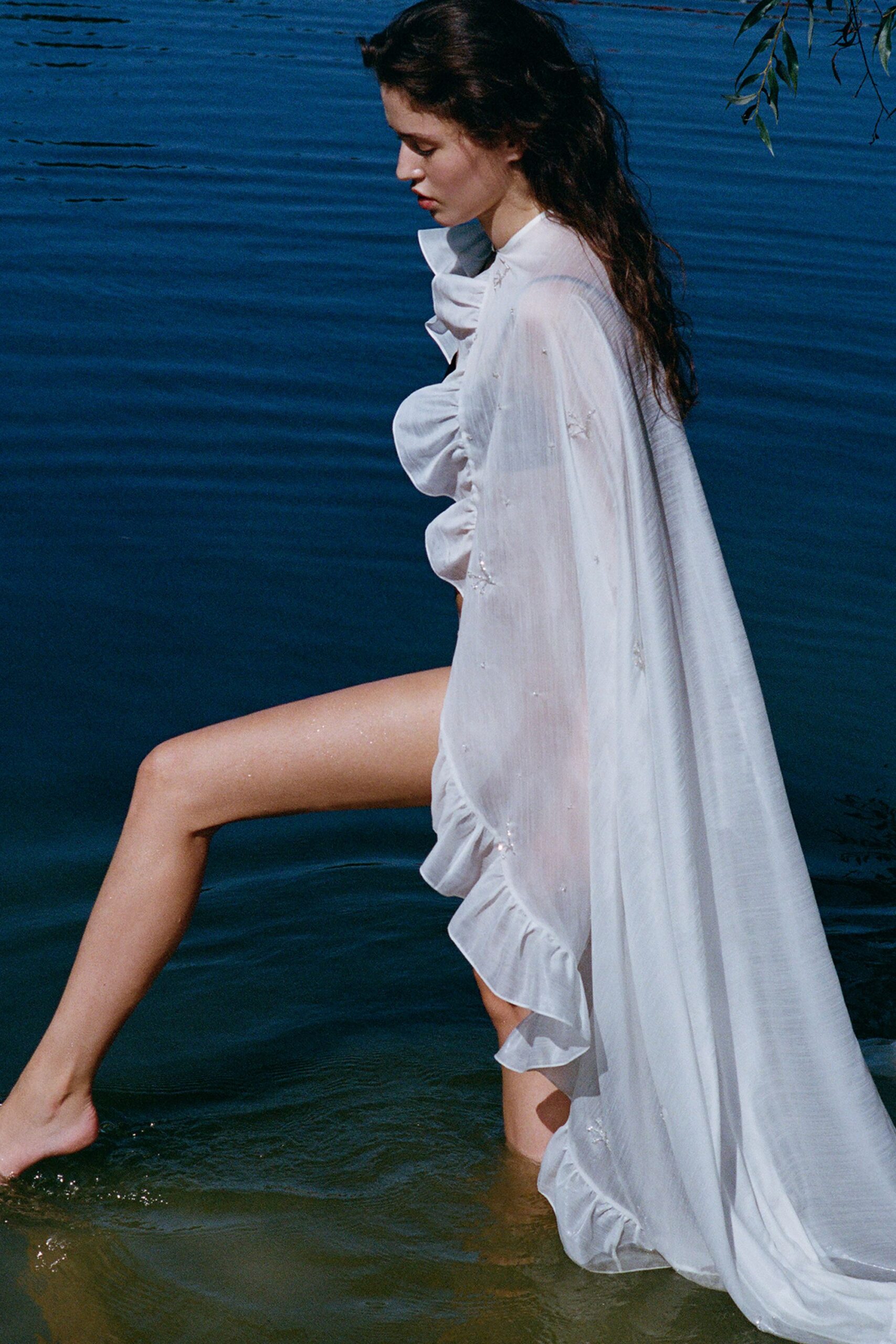 white flowing ruffled gown
