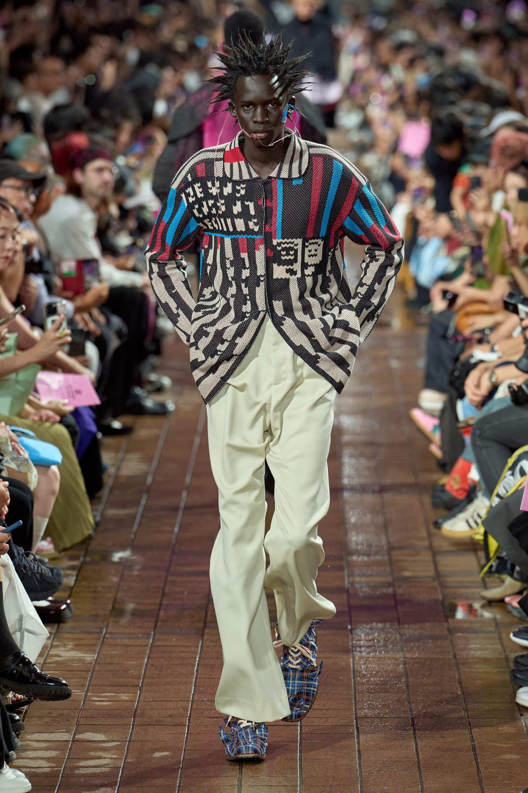 multi-colored relaxed sweater with beige pants