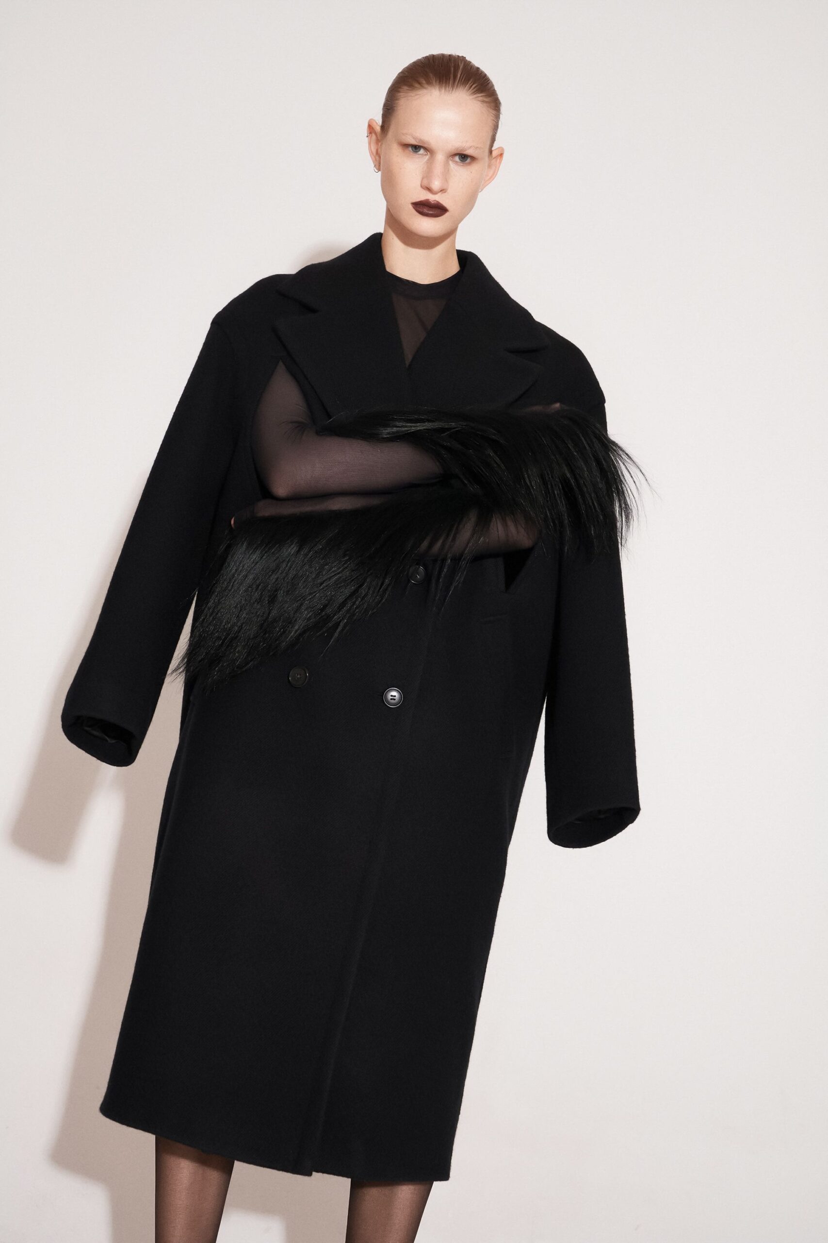 black wool long-sleeve collared oversized draped coat