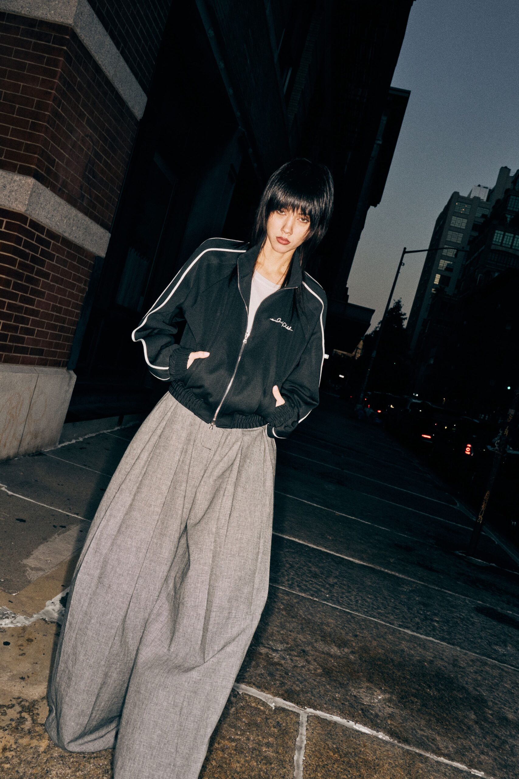 black relaxed jacket with gray wide-leg pants