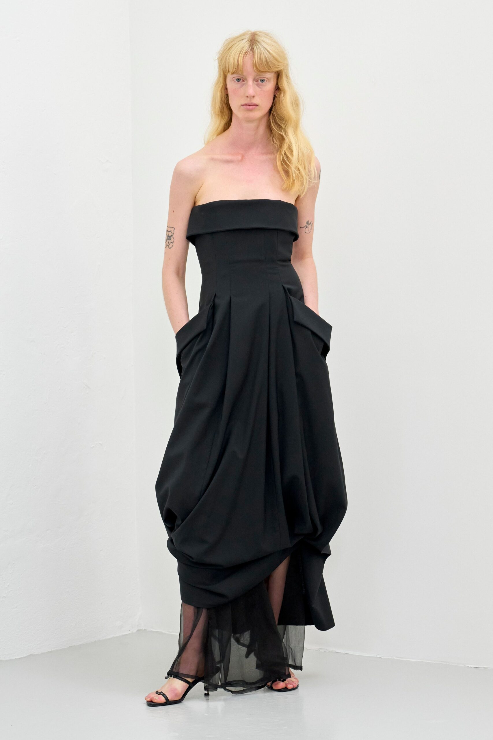 black crepe strapless structured draped layered flowing gown