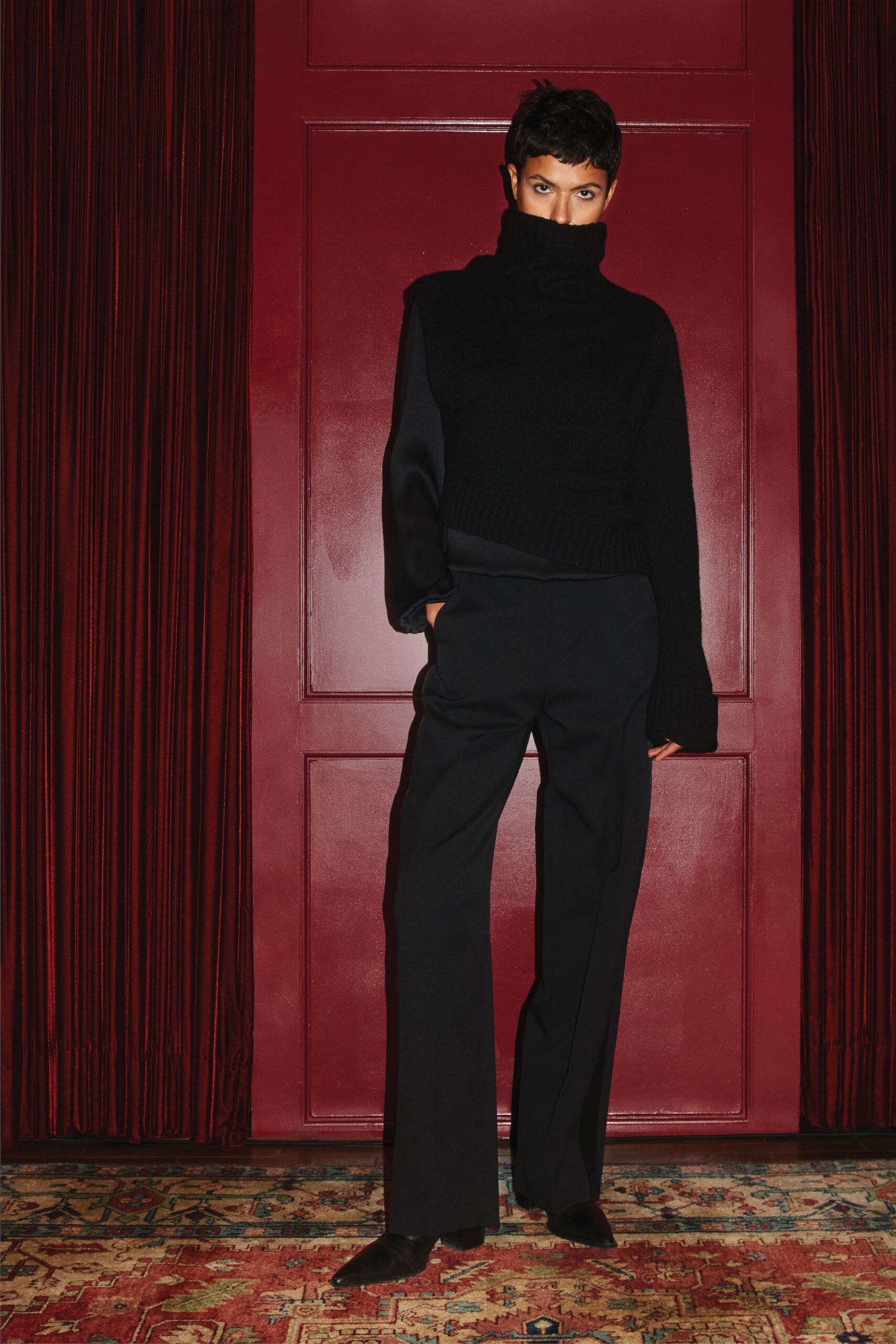 black relaxed sweater and tailored pants