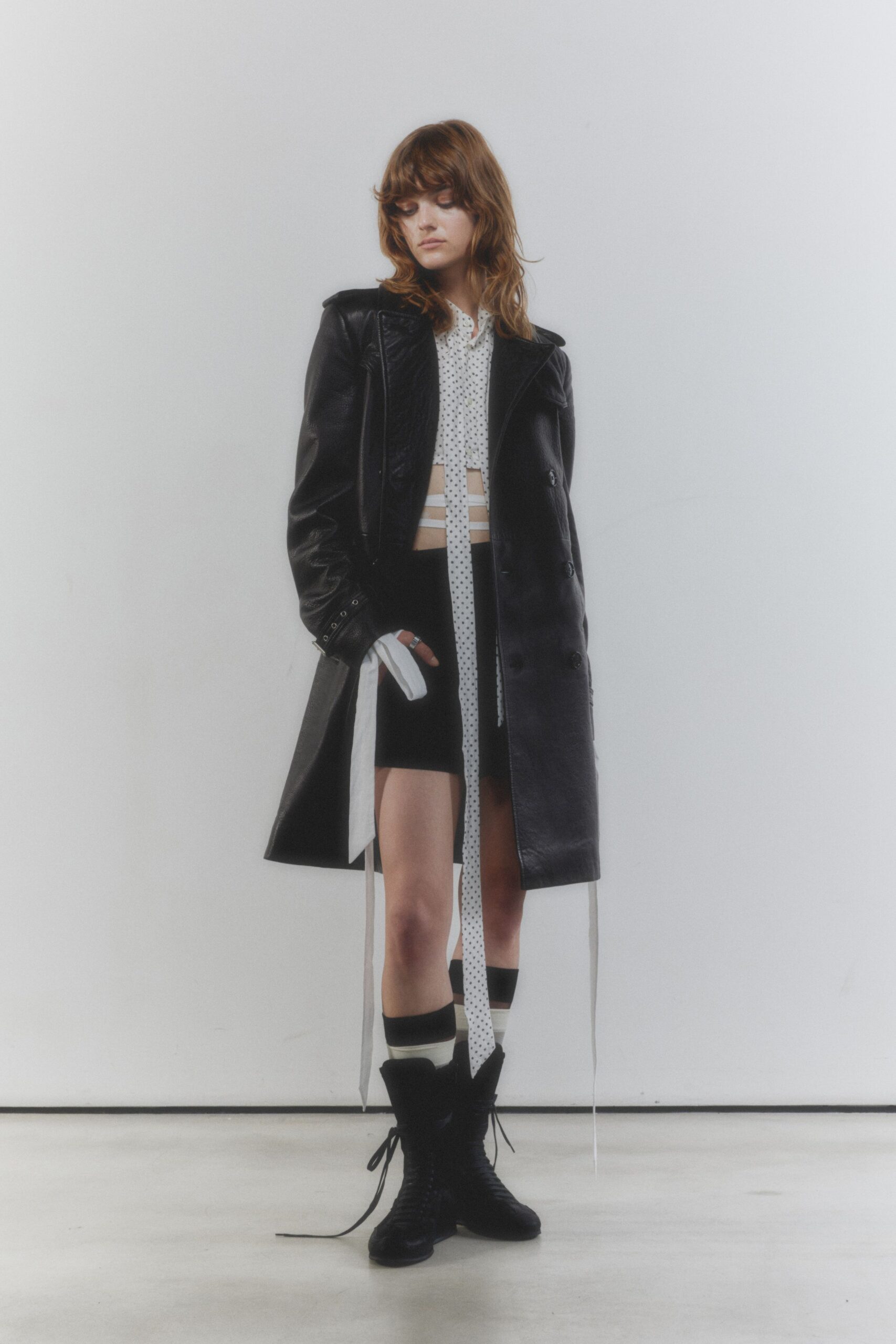 black leather long-sleeve collared oversized buttoned pockets coat