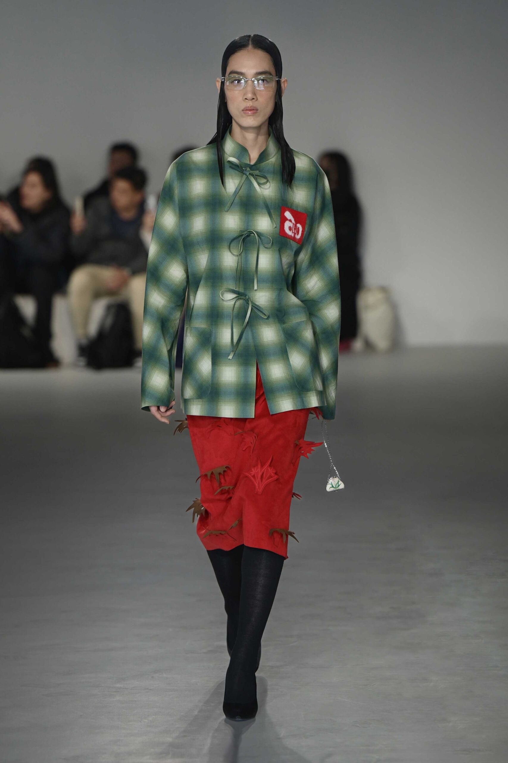 green checked jacket red skirt