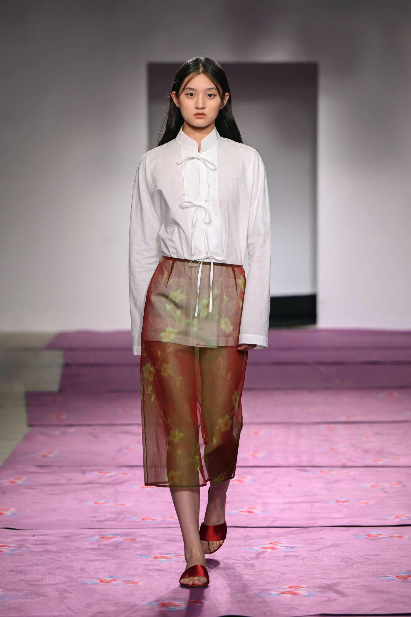 white fitted shirt red sheer skirt