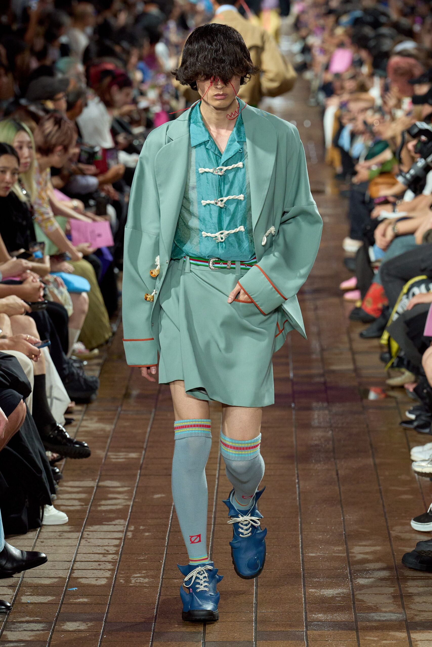 green blazer with pleated skirt