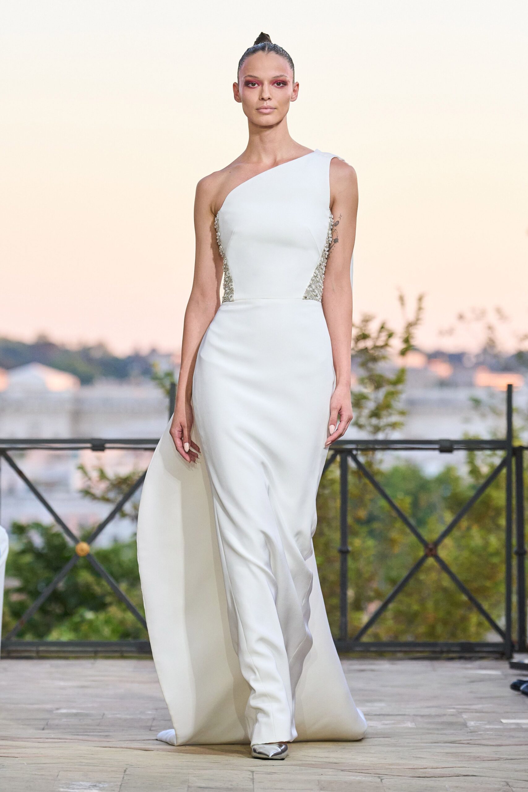 white fitted gown with embellishments