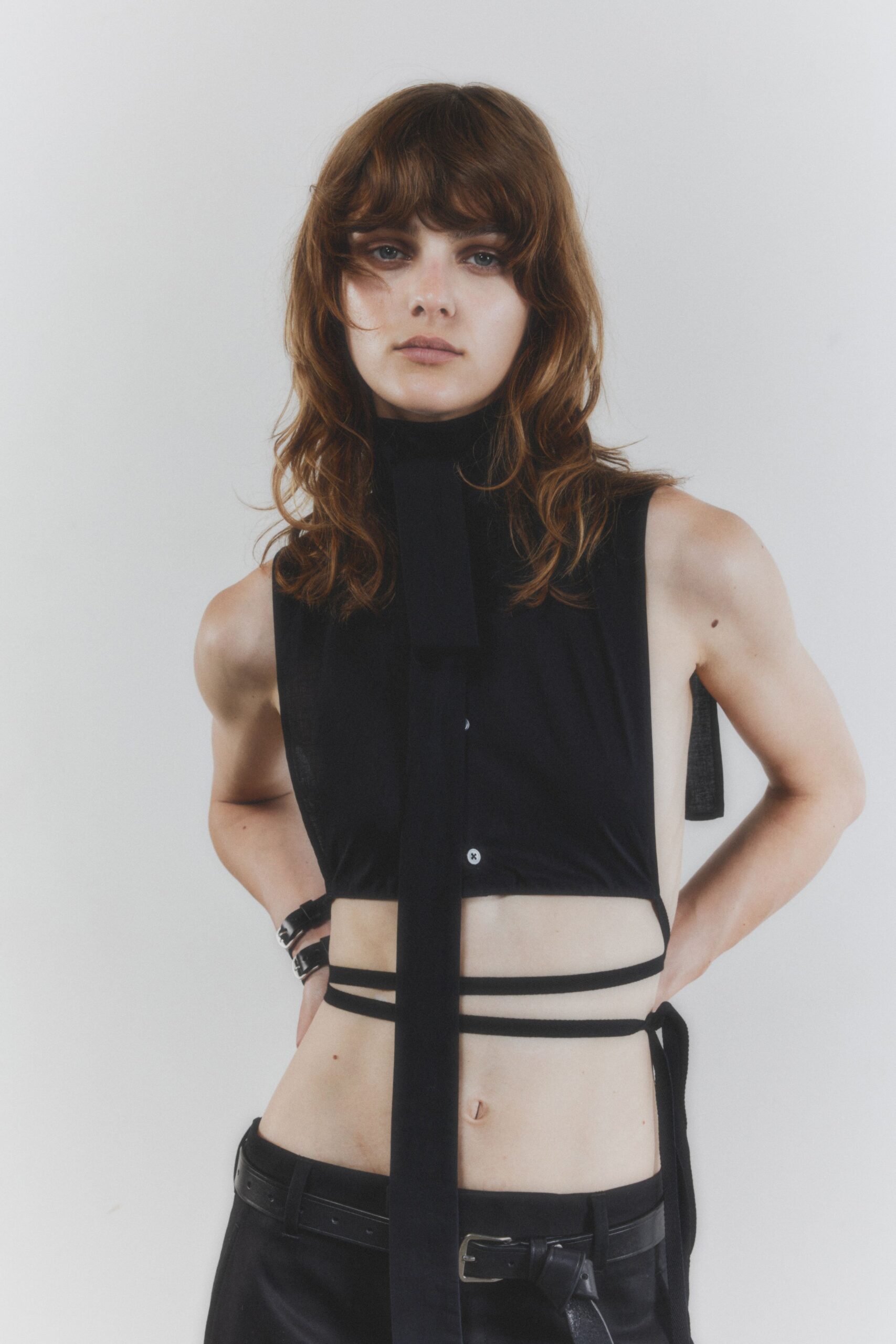 black silk sleeveless high-neck fitted layered cropped top
