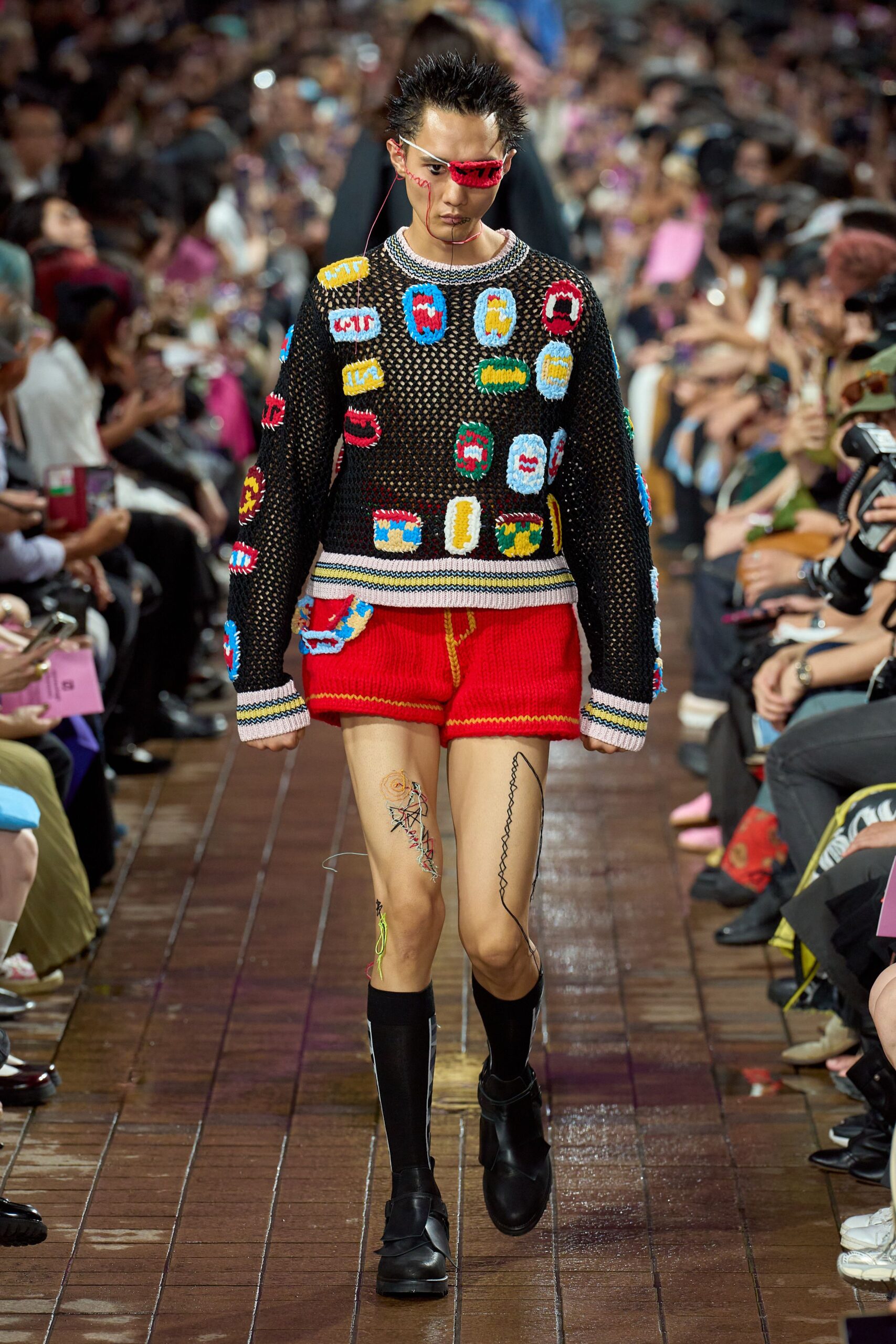 black embroidered sweater red shorts