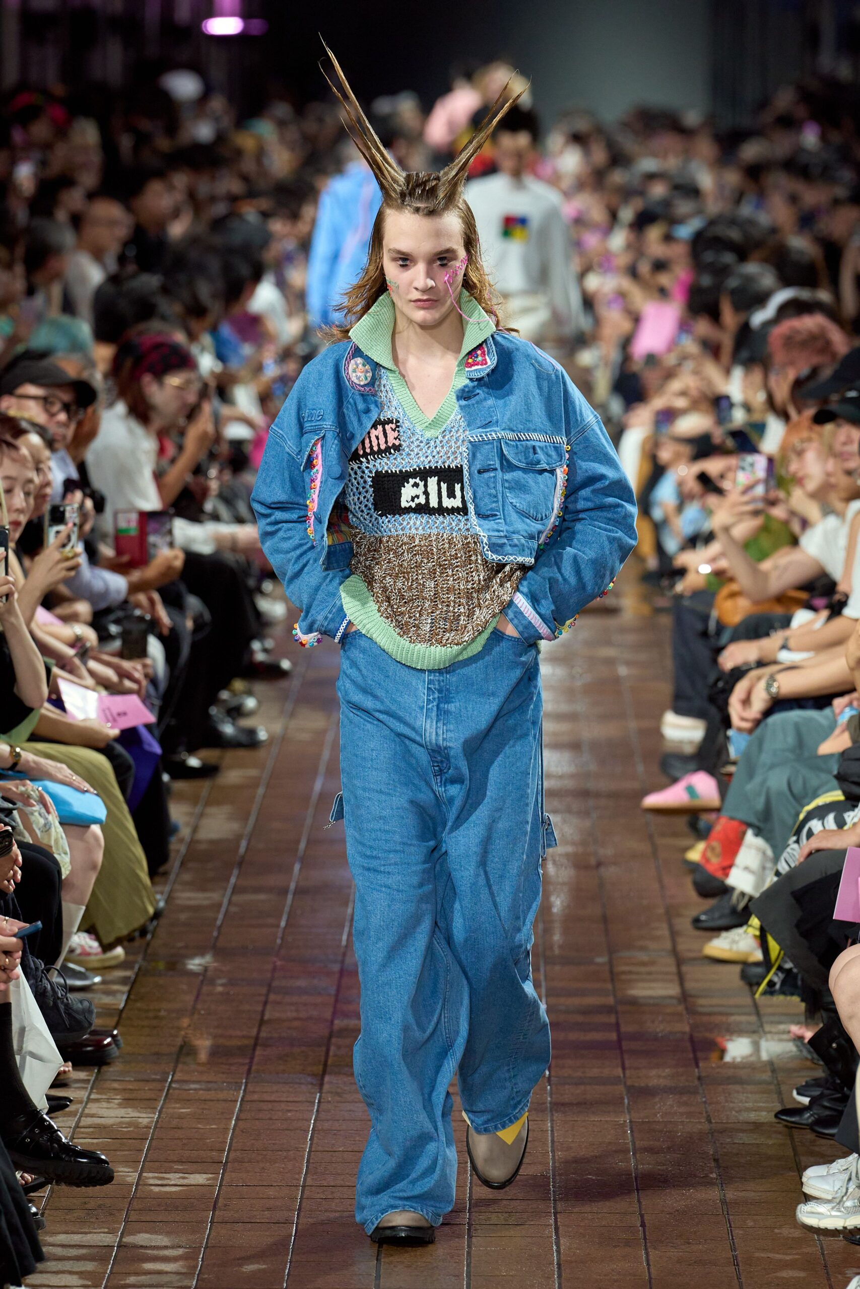 blue denim jacket with green sweater