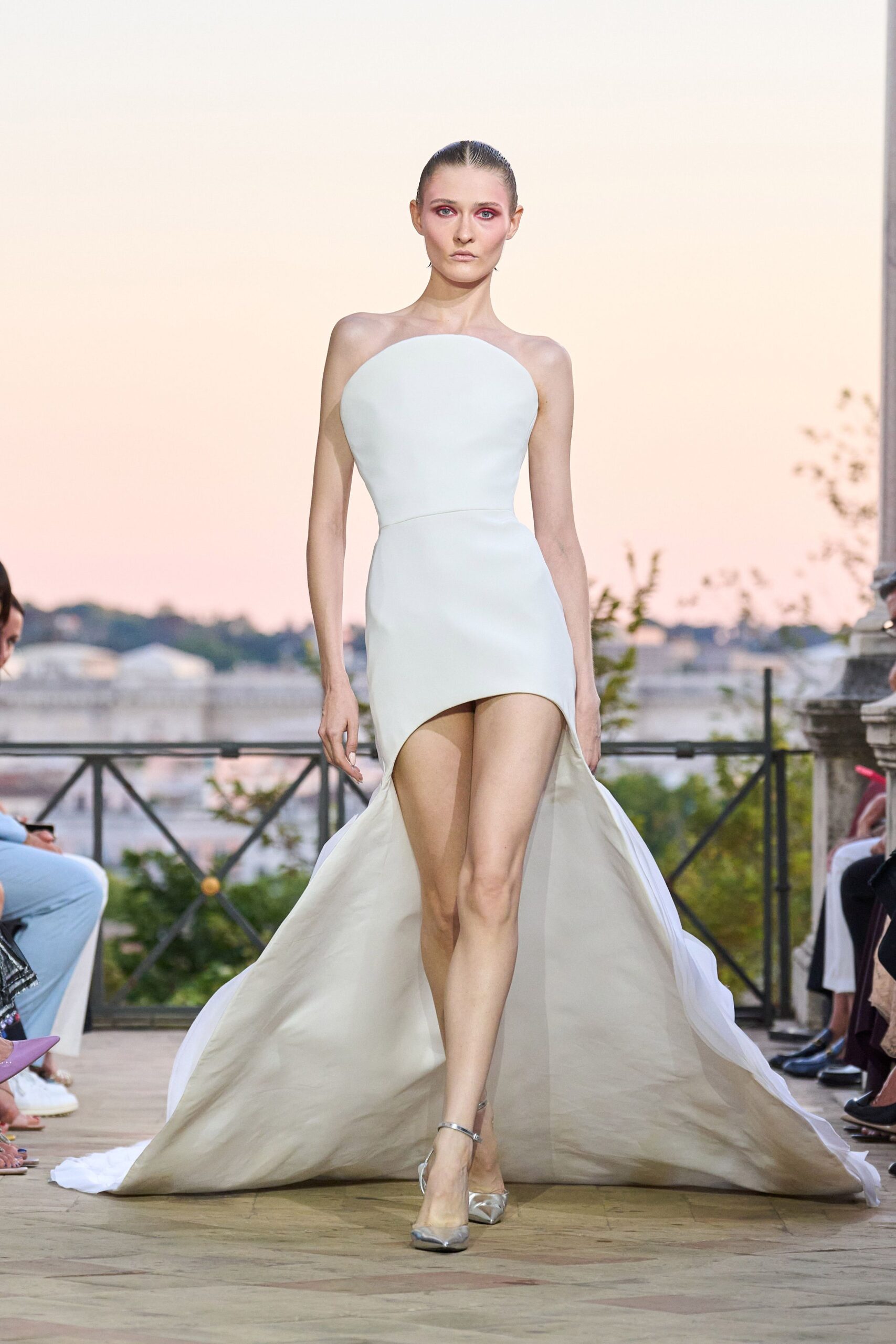 white silk strapless asymmetric fitted draped flowing gown