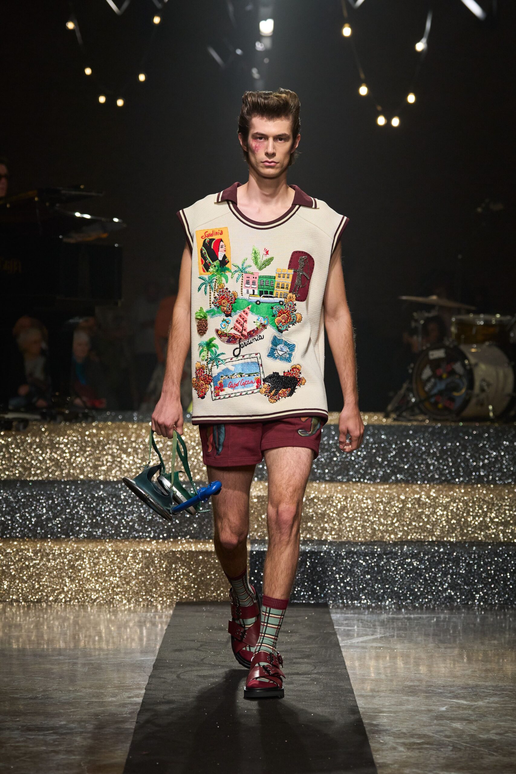 beige embroidered sleeveless top with maroon shorts