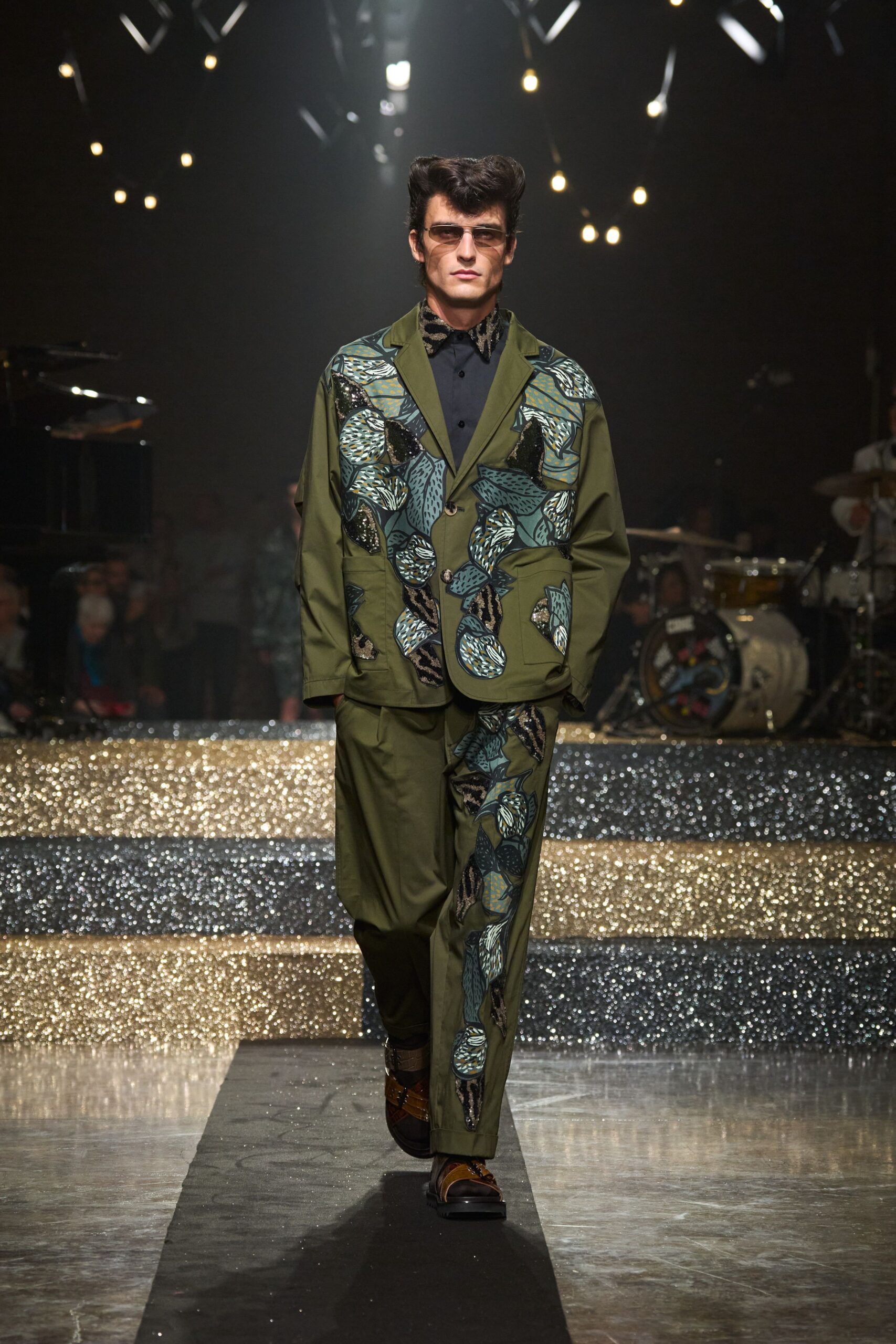 green printed suit with sunglasses