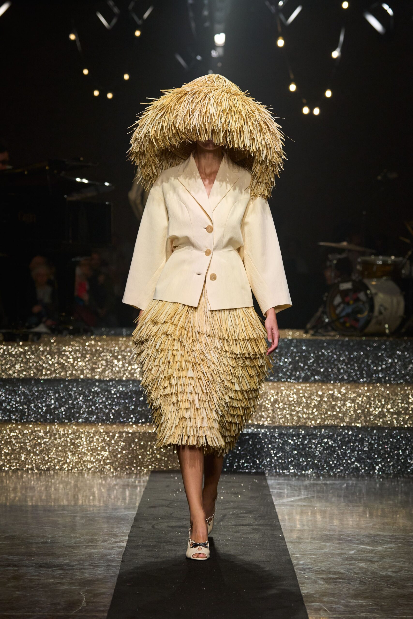 beige structured blazer with gold tiered skirt