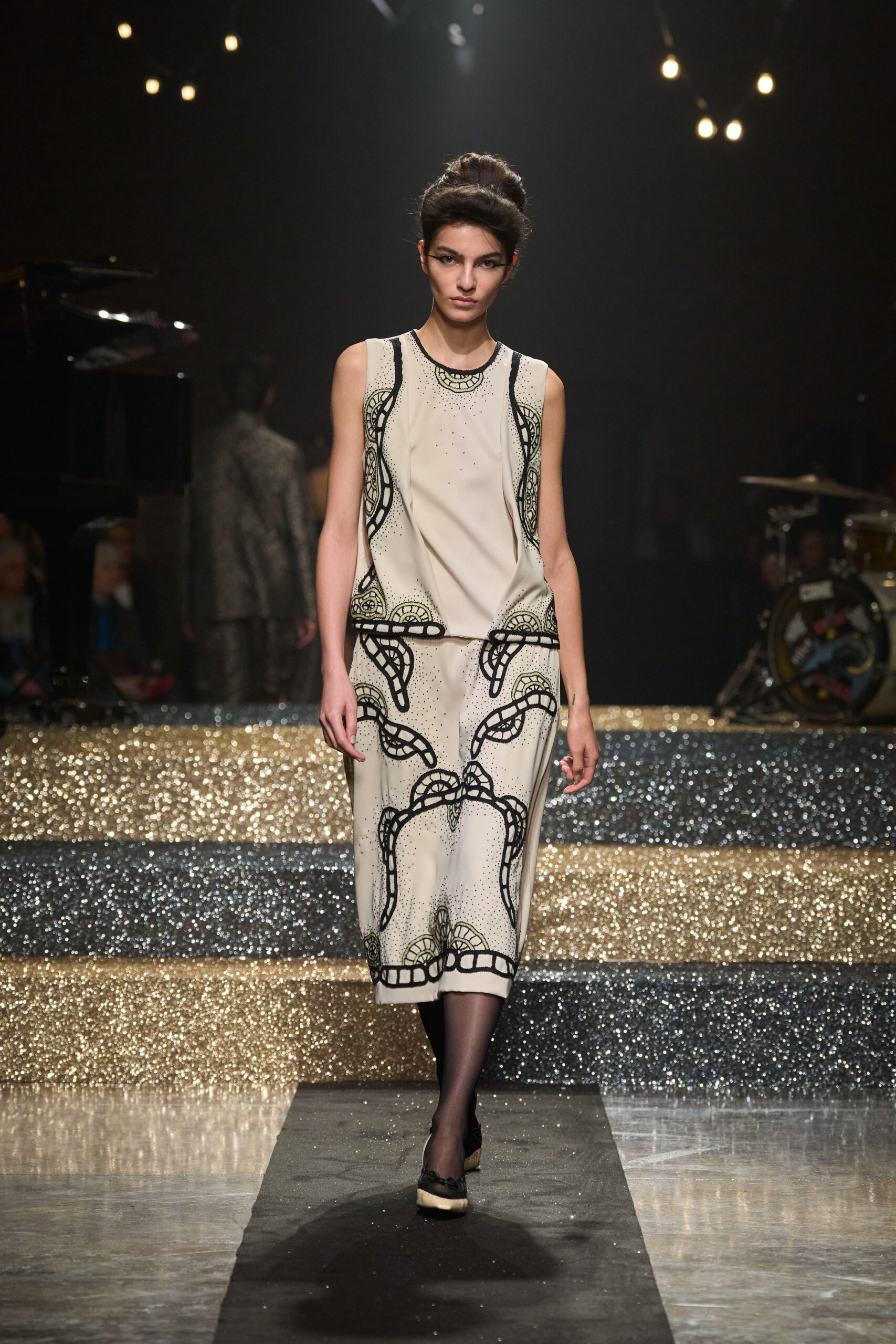 beige embroidered midi dress with black shoes