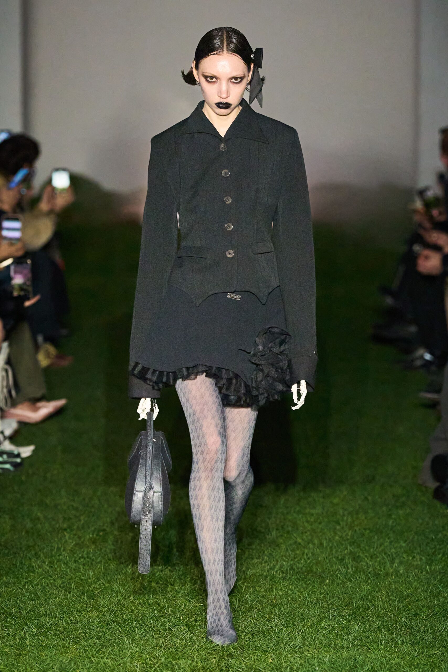 black fitted blazer and mini skirt