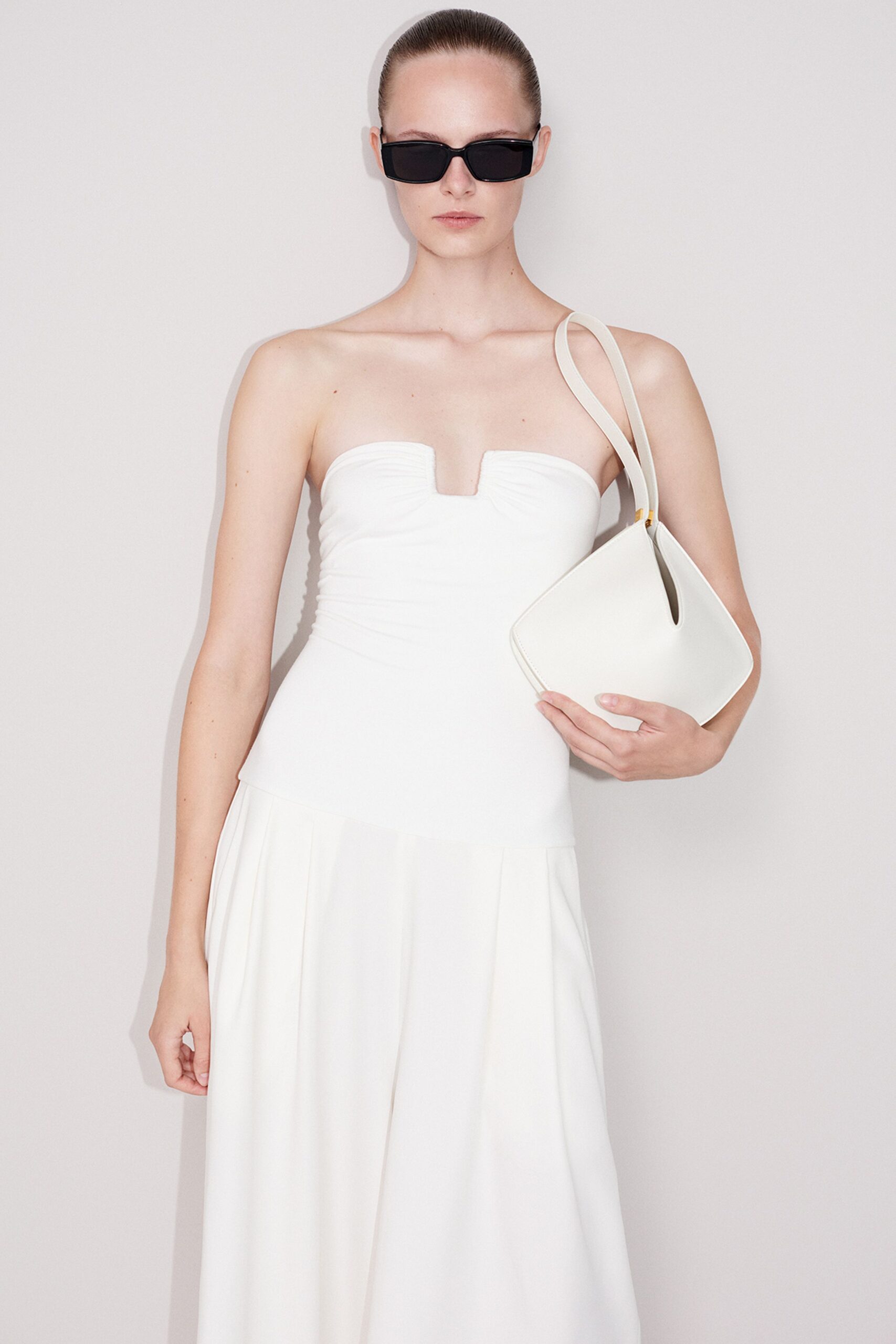 white fitted gown with accessories