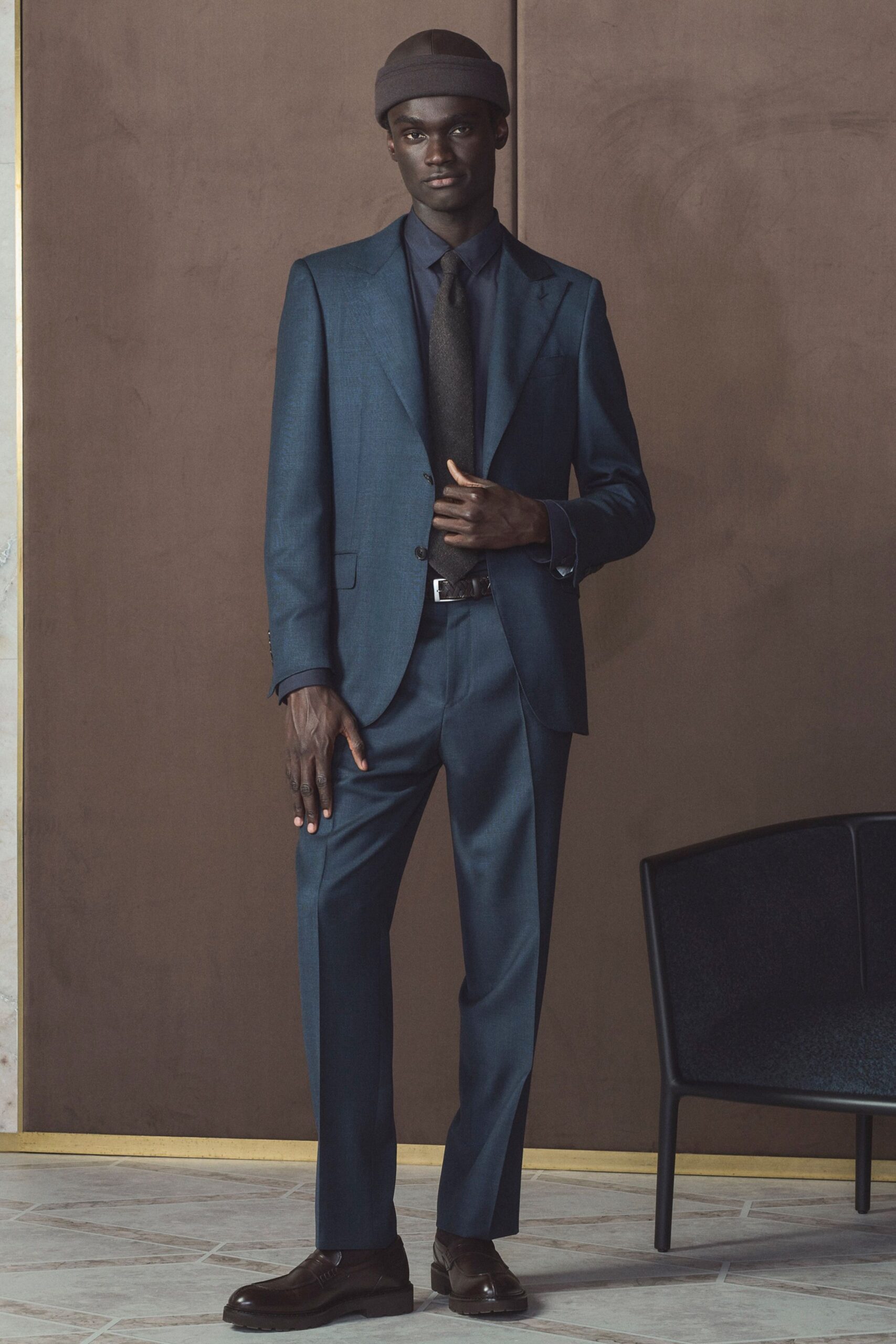 blue tailored suit with hat