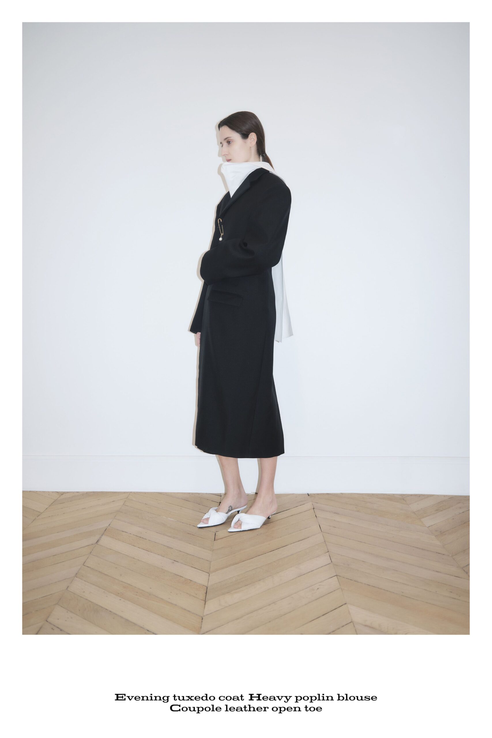 black cotton long-sleeve collared structured buttoned midi coat
